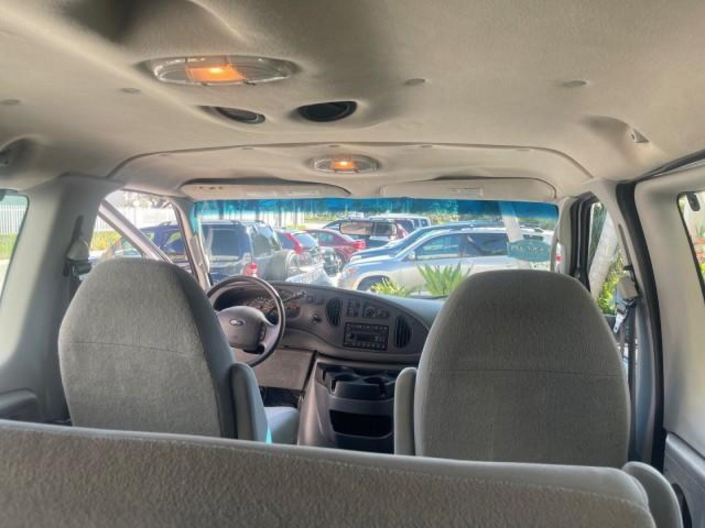 2006 Oxford White /Medium Flint Ford Econoline Wagon XLT LOW MILES 76,474 E350 15 PASS (1FBSS31L36H) with an 5.4L EFI V8 Engine engine, Automatic transmission, located at 4701 North Dixie Hwy, Pompano Beach, FL, 33064, (954) 422-2889, 26.240938, -80.123474 - OUR WEBPAGE FLORIDACARS1.COM HAS OVER 100 PHOTOS AND FREE CARFAX LINK 2006 FORD E-SERIES E-350 SD XLT 15 PASSENGER VAN NEW $29,805 VIN: 1FBSS31L36HA01462 1 F B S S 3 1 L 3 6 H A 0 1 4 6 2 VAN 5.4L V8 F GASOLINE REAR WHEEL DRIVE Features ABS Brakes Air Conditioning AM/FM Stereo Automatic Transmission - Photo#85