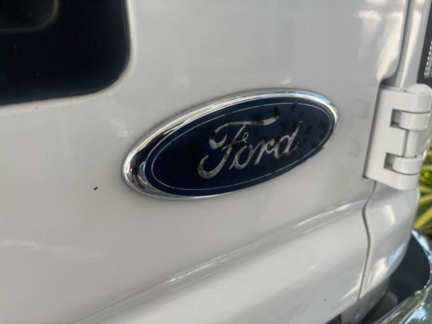 2006 Oxford White /Medium Flint Ford Econoline Wagon XLT LOW MILES 76,474 E350 15 PASS (1FBSS31L36H) with an 5.4L EFI V8 Engine engine, Automatic transmission, located at 4701 North Dixie Hwy, Pompano Beach, FL, 33064, (954) 422-2889, 26.240938, -80.123474 - OUR WEBPAGE FLORIDACARS1.COM HAS OVER 100 PHOTOS AND FREE CARFAX LINK 2006 FORD E-SERIES E-350 SD XLT 15 PASSENGER VAN NEW $29,805 VIN: 1FBSS31L36HA01462 1 F B S S 3 1 L 3 6 H A 0 1 4 6 2 VAN 5.4L V8 F GASOLINE REAR WHEEL DRIVE Features ABS Brakes Air Conditioning AM/FM Stereo Automatic Transmission - Photo#95