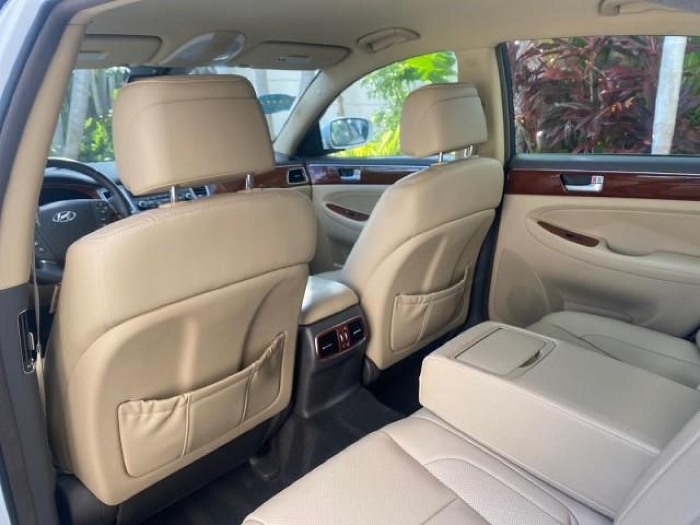 2013 White Satin Pearl /Saddle Hyundai Genesis 3.8L LOW MILES 33,576 (KMHGC4DD5DU) with an 3.8L DOHC GDI 24-Valve V6 Engine engine, Automatic transmission, located at 4701 North Dixie Hwy, Pompano Beach, FL, 33064, (954) 422-2889, 26.240938, -80.123474 - OUR WEBPAGE FLORIDACARS1.COM HAS OVER 100 PHOTOS AND FREE CARFAX LINK 2013 HYUNDAI GENESIS 3.8L VIN: KMHGC4DD5DU257871 K M H G C 4 D D 5 D U 2 5 7 8 7 1 SEDAN 4 DR 3.8L V6 F DOHC 24V GASOLINE REAR WHEEL DRIVE Features ABS Brakes Air Conditioning Alloy Wheels AM/FM Stereo Automatic Transmission Auxil - Photo#76