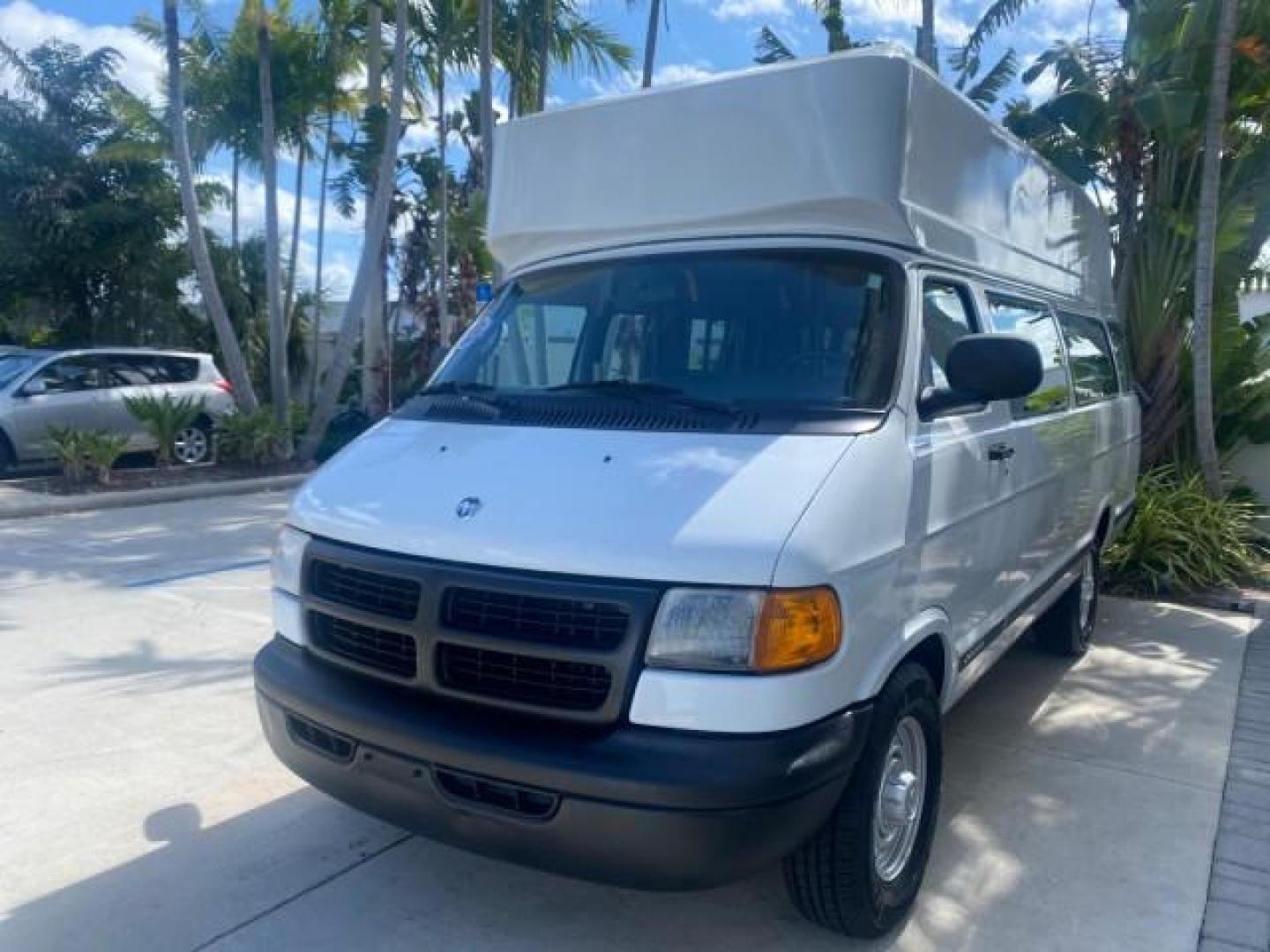 2002 Bright White /Dark Slate Gray Dodge Ram Van LOW MILES 61,263 HIGH TOP CONVERSION (2B7LB31Z42K) with an 5.9L MPI V8 Magnum Engine engine, Automatic transmission, located at 4701 North Dixie Hwy, Pompano Beach, FL, 33064, (954) 422-2889, 26.240938, -80.123474 - OUR WEBPAGE FLORIDACARS1.COM HAS OVER 100 PHOTOS AND FREE CARFAX LINK 2002 DODGE RAM VAN 3500 MAXI EXTENDED HIGH TOP 11 SEATER HANDICAP LIFT VIN: 2B7LB31Z42K117751 2 B 7 L B 3 1 Z 4 2 K 1 1 7 7 5 1 VAN 5.9L V8 F OHV 16V GASOLINE REAR WHEEL DRIVE Features ABS Brakes Air Conditioning AM/FM Stereo Auto - Photo#3