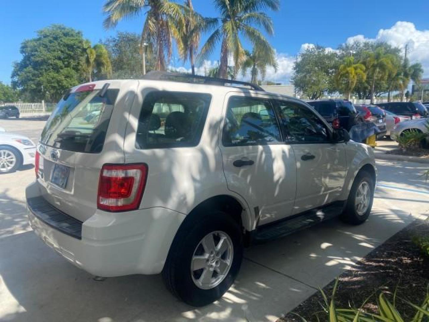 2011 Oxford White /Stone Ford Escape XLS LOW MILES 28,150 (1FMCU0C76BK) with an 2.5L I4 Duratec Engine engine, Automatic transmission, located at 4701 North Dixie Hwy, Pompano Beach, FL, 33064, (954) 422-2889, 26.240938, -80.123474 - OUR WEBPAGE FLORIDACARS1.COM HAS OVER 100 PHOTOS AND FREE CARFAX LINK 2011 FORD ESCAPE XLS VIN: 1FMCU0C76BKB57805 1 F M C U 0 C 7 6 B K B 5 7 8 0 5 4 DOOR WAGON/SPORT UTILITY 2.5L I4 F DOHC 16V GASOLINE FRONT WHEEL DRIVE Features ABS Brakes Air Conditioning Alloy Wheels AM/FM Stereo Automatic Transm - Photo#7