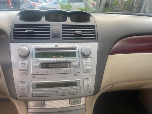 2005 Absolutely Red /Ivory Toyota Camry Solara SLE LOW MILES 63,889 (4T1FA38P85U) with an 3.3L DOHC SEFI VVT-i 24-Valve V6 Engine engine, Automatic transmission, located at 4701 North Dixie Hwy, Pompano Beach, FL, 33064, (954) 422-2889, 26.240938, -80.123474 - OUR WEBPAGE FLORIDACARS1.COM HAS OVER 100 PHOTOS AND FREE CARFAX LINK 2005 TOYOTA CAMRY SOLARA SLE V6 LOADED TOP OF THE LINE VIN: 4T1FA38P85U063157 4 T 1 F A 3 8 P 8 5 U 0 6 3 1 5 7 CONVERTIBLE 3.3L V6 F DOHC 24V GASOLINE FRONT WHEEL DRIVE Features ABS Brakes Air Conditioning Alloy Wheels AM/FM Ster - Photo#78