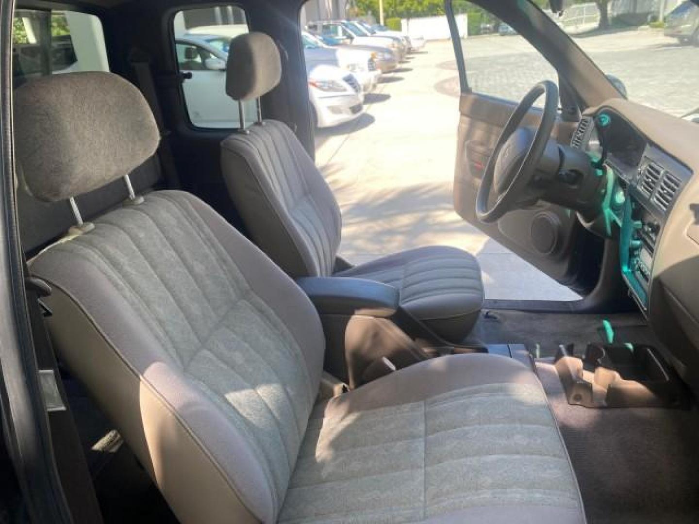 2000 Black Sand Pearl /Oak Toyota Tacoma LOW MILES 74,047 1 OWNER (4TAVL52N2YZ) with an 2.4L DOHC EFI 16-Valve I4 Engine engine, Automatic transmission, located at 4701 North Dixie Hwy, Pompano Beach, FL, 33064, (954) 422-2889, 26.240938, -80.123474 - OUR WEBPAGE FLORIDACARS1.COM HAS OVER 100 PHOTOS AND FREE CARFAX LINK 2000 TOYOTA TACOMA SR5 VIN: 4TAVL52N2YZ618796 4 T A V L 5 2 N 2 Y Z 6 1 8 7 9 6 CLUB CAB PICKUP 2.4L I4 F DOHC GASOLINE 29 MPG REAR WHEEL DRIVE Features Air Conditioning AM/FM Stereo Automatic Transmission Bed Liner Cassette Playe - Photo#12