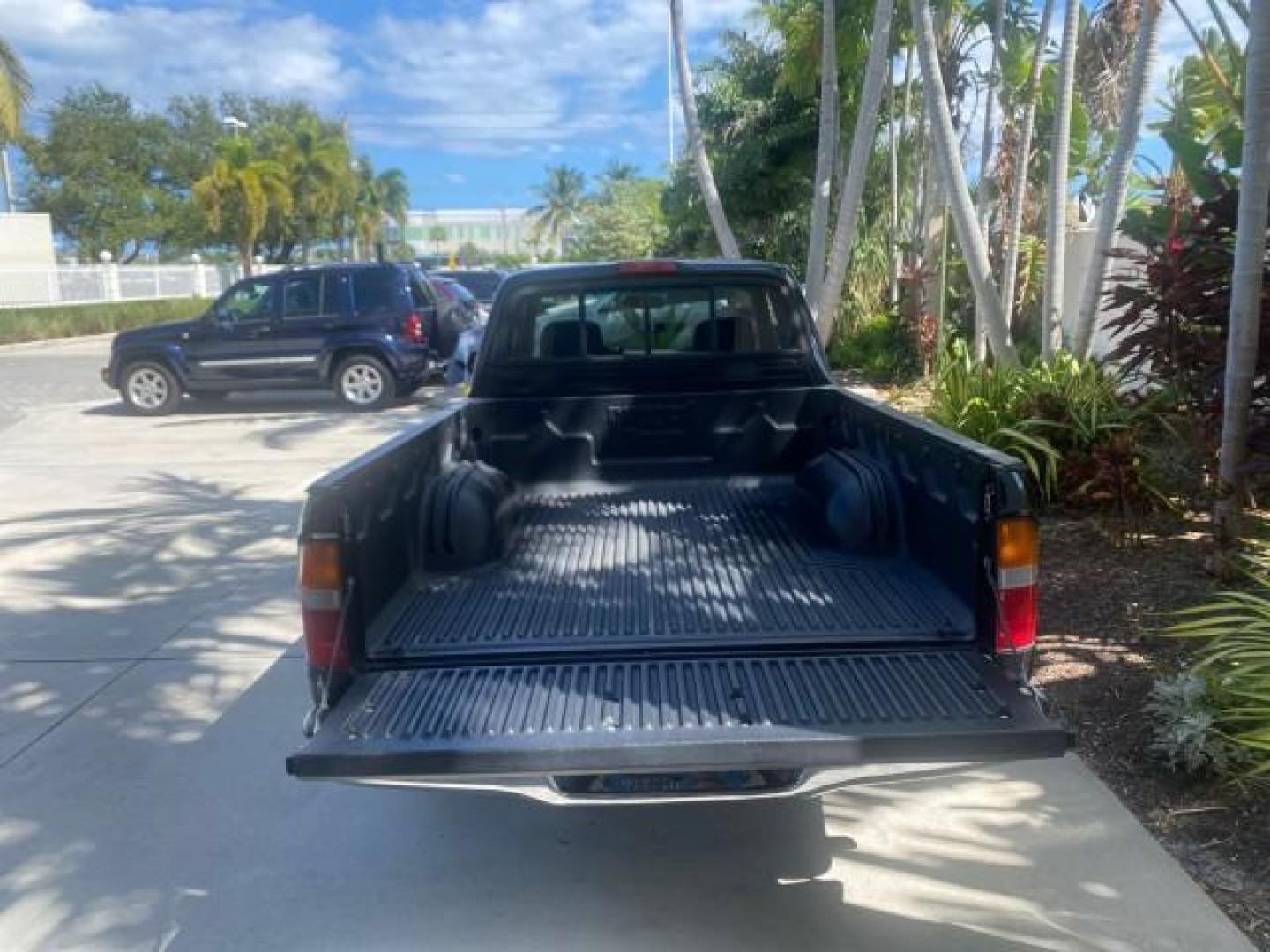 2000 Black Sand Pearl /Oak Toyota Tacoma LOW MILES 74,047 1 OWNER (4TAVL52N2YZ) with an 2.4L DOHC EFI 16-Valve I4 Engine engine, Automatic transmission, located at 4701 North Dixie Hwy, Pompano Beach, FL, 33064, (954) 422-2889, 26.240938, -80.123474 - OUR WEBPAGE FLORIDACARS1.COM HAS OVER 100 PHOTOS AND FREE CARFAX LINK 2000 TOYOTA TACOMA SR5 VIN: 4TAVL52N2YZ618796 4 T A V L 5 2 N 2 Y Z 6 1 8 7 9 6 CLUB CAB PICKUP 2.4L I4 F DOHC GASOLINE 29 MPG REAR WHEEL DRIVE Features Air Conditioning AM/FM Stereo Automatic Transmission Bed Liner Cassette Playe - Photo#15