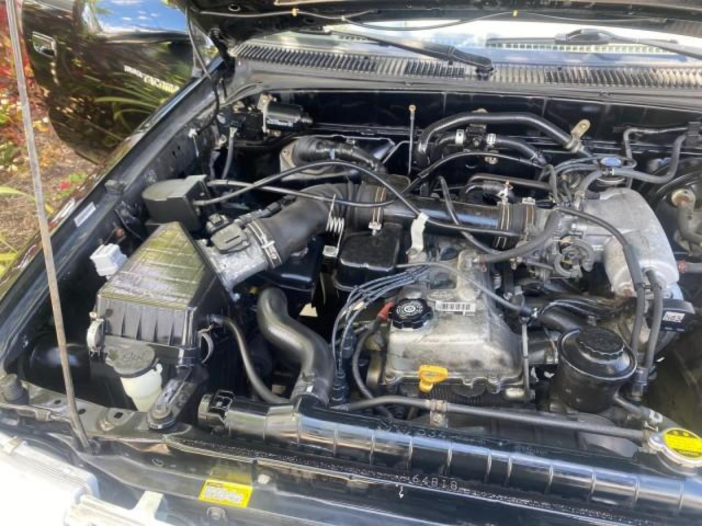 2000 Black Sand Pearl /Oak Toyota Tacoma LOW MILES 74,047 1 OWNER (4TAVL52N2YZ) with an 2.4L DOHC EFI 16-Valve I4 Engine engine, Automatic transmission, located at 4701 North Dixie Hwy, Pompano Beach, FL, 33064, (954) 422-2889, 26.240938, -80.123474 - OUR WEBPAGE FLORIDACARS1.COM HAS OVER 100 PHOTOS AND FREE CARFAX LINK 2000 TOYOTA TACOMA SR5 VIN: 4TAVL52N2YZ618796 4 T A V L 5 2 N 2 Y Z 6 1 8 7 9 6 CLUB CAB PICKUP 2.4L I4 F DOHC GASOLINE 29 MPG REAR WHEEL DRIVE Features Air Conditioning AM/FM Stereo Automatic Transmission Bed Liner Cassette Playe - Photo#25