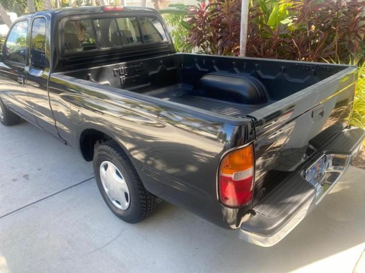 2000 Black Sand Pearl /Oak Toyota Tacoma LOW MILES 74,047 1 OWNER (4TAVL52N2YZ) with an 2.4L DOHC EFI 16-Valve I4 Engine engine, Automatic transmission, located at 4701 North Dixie Hwy, Pompano Beach, FL, 33064, (954) 422-2889, 26.240938, -80.123474 - OUR WEBPAGE FLORIDACARS1.COM HAS OVER 100 PHOTOS AND FREE CARFAX LINK 2000 TOYOTA TACOMA SR5 VIN: 4TAVL52N2YZ618796 4 T A V L 5 2 N 2 Y Z 6 1 8 7 9 6 CLUB CAB PICKUP 2.4L I4 F DOHC GASOLINE 29 MPG REAR WHEEL DRIVE Features Air Conditioning AM/FM Stereo Automatic Transmission Bed Liner Cassette Playe - Photo#90