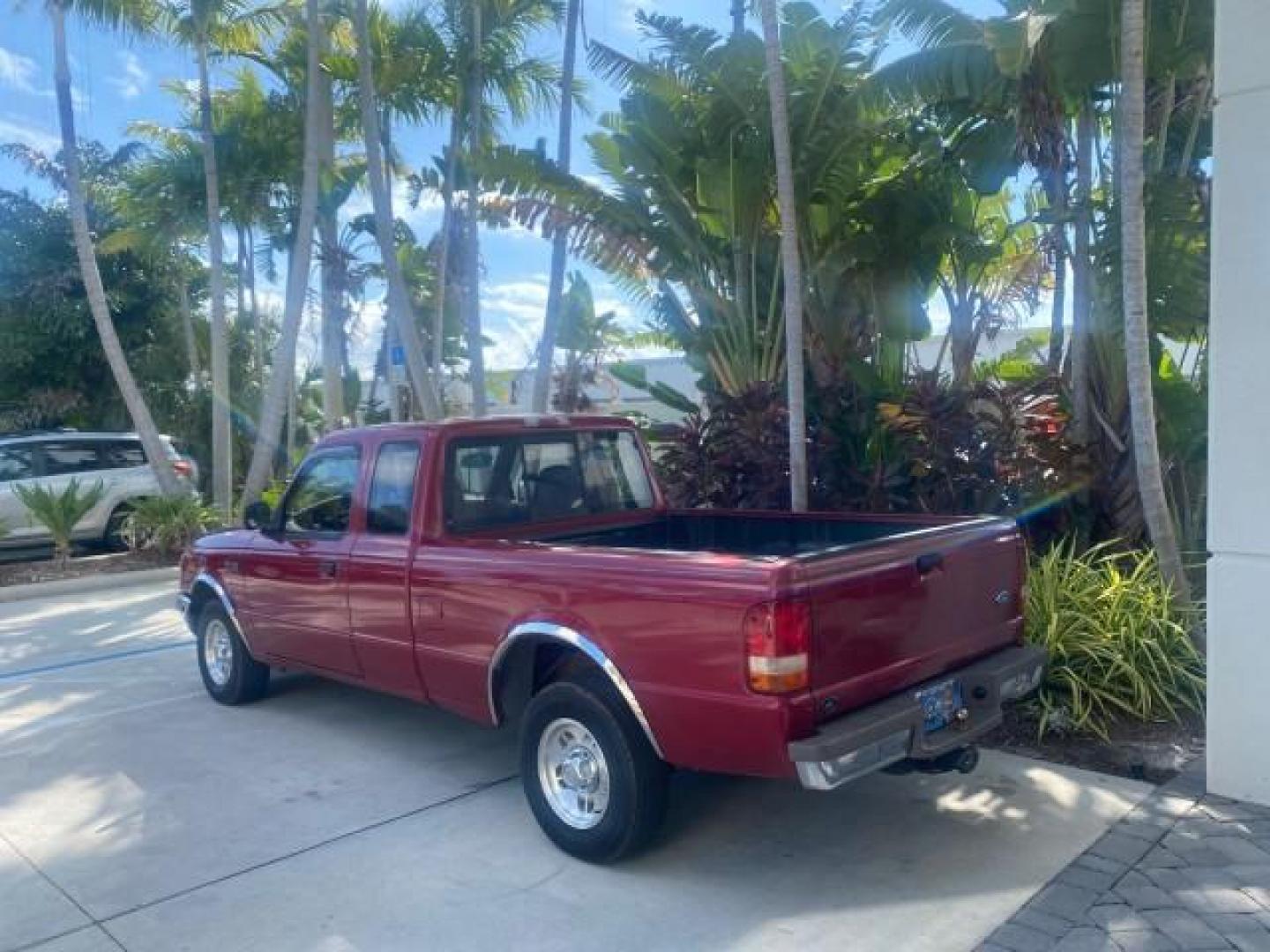 1995 Red /Tan Ford Ranger XLT EXTENDED CAB LOW MILES 64,867 (1FTCR14X7ST) with an 4.0L SPFI V6 Engine engine, Automatic transmission, located at 4701 North Dixie Hwy, Pompano Beach, FL, 33064, (954) 422-2889, 26.240938, -80.123474 - OUR WEBPAGE FLORIDACARS1.COM HAS OVER 100 PHOTOS AND FREE CARFAX LINK 1995 FORD RANGER SPLASH EXTENDED CAB - ICE COLD AC VIN: 1FTCR14X7STA40495 1 F T C R 1 4 X 7 S T A 4 0 4 9 5 CLUB CAB PICKUP 4.0L V6 F GASOLINE 29 MPG REAR WHEEL DRIVE Features ABS Brakes Air Conditioning Alloy Wheels AM/FM Stereo - Photo#5
