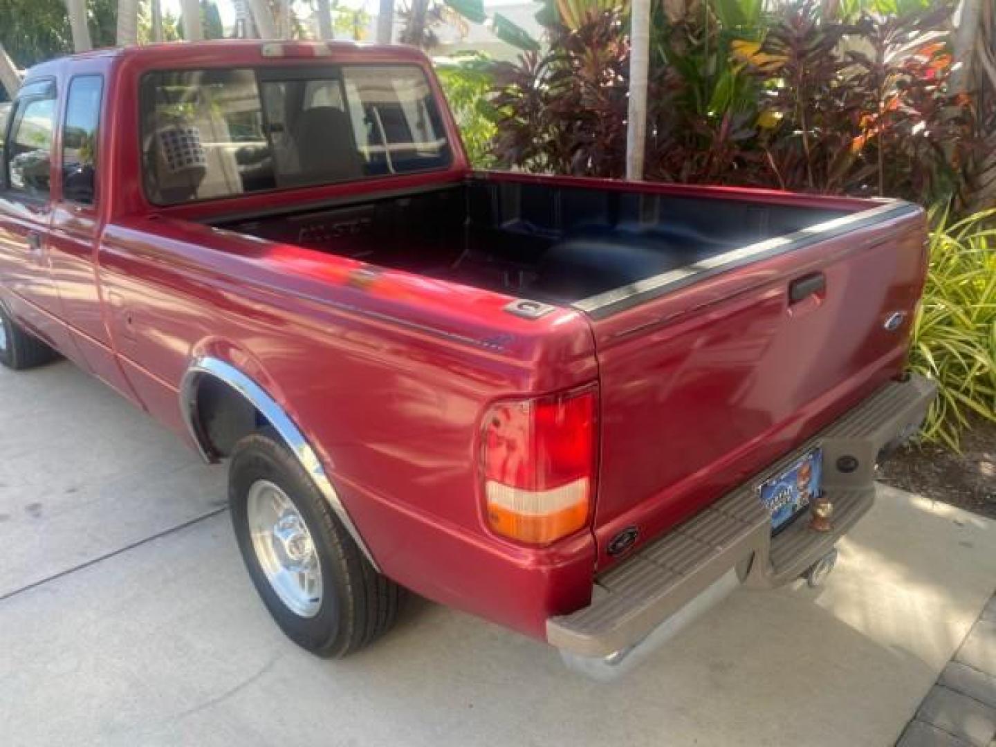 1995 Red /Tan Ford Ranger XLT EXTENDED CAB LOW MILES 64,867 (1FTCR14X7ST) with an 4.0L SPFI V6 Engine engine, Automatic transmission, located at 4701 North Dixie Hwy, Pompano Beach, FL, 33064, (954) 422-2889, 26.240938, -80.123474 - OUR WEBPAGE FLORIDACARS1.COM HAS OVER 100 PHOTOS AND FREE CARFAX LINK 1995 FORD RANGER SPLASH EXTENDED CAB - ICE COLD AC VIN: 1FTCR14X7STA40495 1 F T C R 1 4 X 7 S T A 4 0 4 9 5 CLUB CAB PICKUP 4.0L V6 F GASOLINE 29 MPG REAR WHEEL DRIVE Features ABS Brakes Air Conditioning Alloy Wheels AM/FM Stereo - Photo#75
