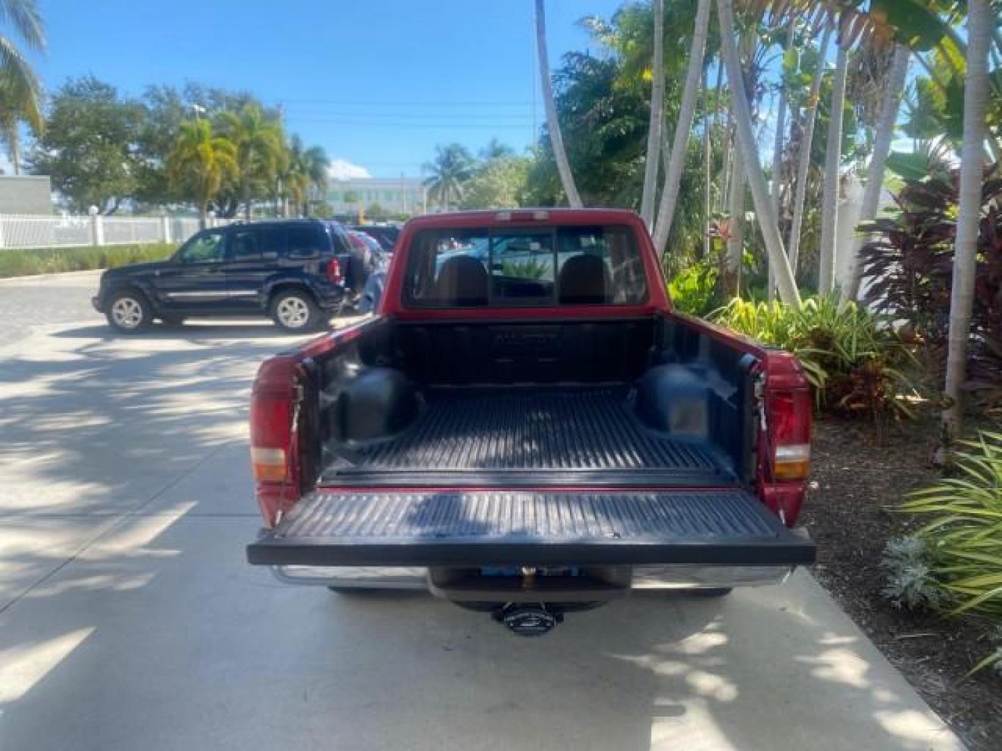 1995 Red /Tan Ford Ranger XLT EXTENDED CAB LOW MILES 64,867 (1FTCR14X7ST) with an 4.0L SPFI V6 Engine engine, Automatic transmission, located at 4701 North Dixie Hwy, Pompano Beach, FL, 33064, (954) 422-2889, 26.240938, -80.123474 - OUR WEBPAGE FLORIDACARS1.COM HAS OVER 100 PHOTOS AND FREE CARFAX LINK 1995 FORD RANGER SPLASH EXTENDED CAB - ICE COLD AC VIN: 1FTCR14X7STA40495 1 F T C R 1 4 X 7 S T A 4 0 4 9 5 CLUB CAB PICKUP 4.0L V6 F GASOLINE 29 MPG REAR WHEEL DRIVE Features ABS Brakes Air Conditioning Alloy Wheels AM/FM Stereo - Photo#81