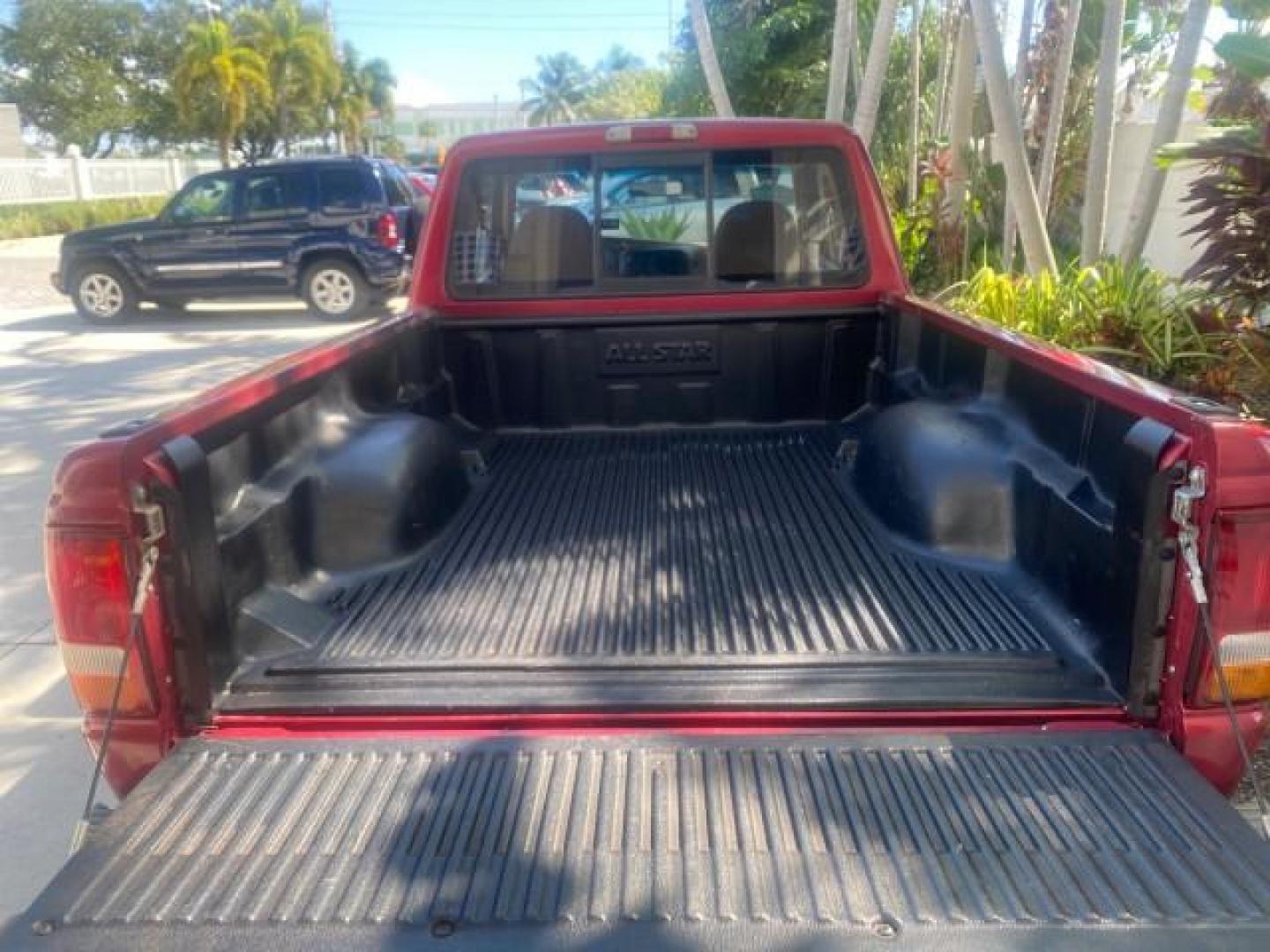 1995 Red /Tan Ford Ranger XLT EXTENDED CAB LOW MILES 64,867 (1FTCR14X7ST) with an 4.0L SPFI V6 Engine engine, Automatic transmission, located at 4701 North Dixie Hwy, Pompano Beach, FL, 33064, (954) 422-2889, 26.240938, -80.123474 - OUR WEBPAGE FLORIDACARS1.COM HAS OVER 100 PHOTOS AND FREE CARFAX LINK 1995 FORD RANGER SPLASH EXTENDED CAB - ICE COLD AC VIN: 1FTCR14X7STA40495 1 F T C R 1 4 X 7 S T A 4 0 4 9 5 CLUB CAB PICKUP 4.0L V6 F GASOLINE 29 MPG REAR WHEEL DRIVE Features ABS Brakes Air Conditioning Alloy Wheels AM/FM Stereo - Photo#82
