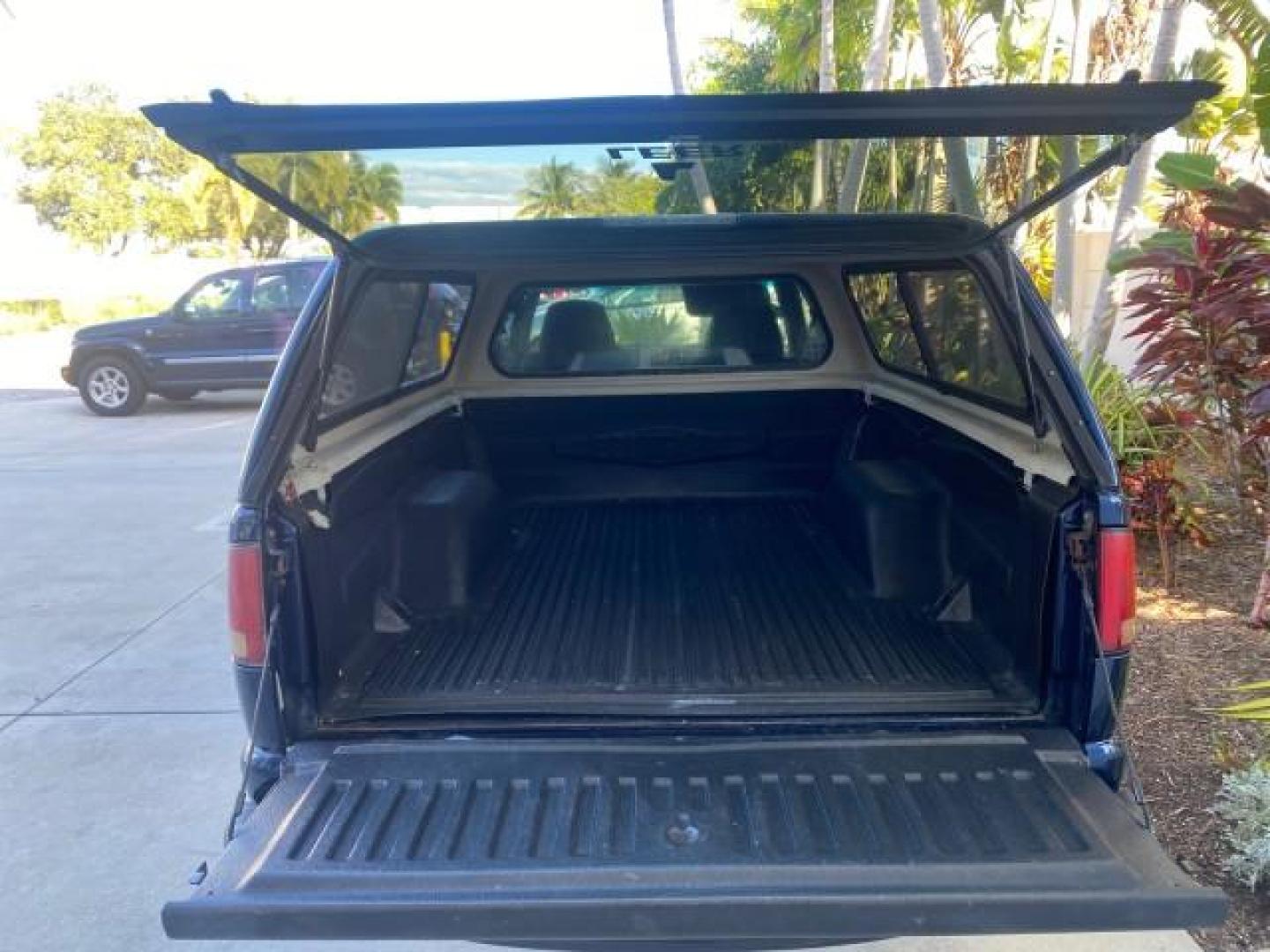 2001 Indigo Blue Metallic /Graphite GMC Sonoma X CAB SLS LOW MILES 70,869 (1GTCS19W618) with an 4.3L Vortec 1000 SFI V6 Engine engine, Automatic transmission, located at 4701 North Dixie Hwy, Pompano Beach, FL, 33064, (954) 422-2889, 26.240938, -80.123474 - OUR WEBPAGE FLORIDACARS1.COM HAS OVER 100 PHOTOS AND FREE CARFAX LINK 2001 GMC SONOMA SL EXTRACAB AUTO AC VIN: 1GTCS19W618237485 1 G T C S 1 9 W 6 1 8 2 3 7 4 8 5 CLUB CAB PICKUP 4.3L V6 F GASOLINE REAR WHEEL DRIVE Features ABS Brakes Air Conditioning Alloy Wheels AM/FM Stereo Automatic Transmission - Photo#81