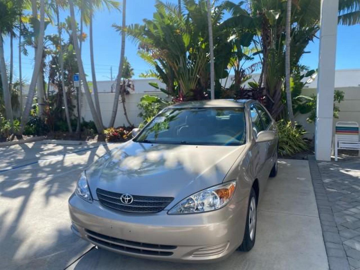 2004 Desert Sand Mica /Taupe Toyota Camry LE LOW MILES 25,414 ACTUAL (4T1BE32K04U) with an 2.4L DOHC MPFI Vvti 16-Valve 4-Cyl Engine engine, Automatic transmission, located at 4701 North Dixie Hwy, Pompano Beach, FL, 33064, (954) 422-2889, 26.240938, -80.123474 - OUR WEBPAGE FLORIDACARS1.COM HAS OVER 100 PHOTOS AND FREE CARFAX LINK 2004 TOYOTA CAMRY LE VIN: 4T1BE32K04U806344 4 T 1 B E 3 2 K 0 4 U 8 0 6 3 4 4 SEDAN 4 DR 2.4L I4 F DOHC 16V GASOLINE 32 MPG FRONT WHEEL DRIVE Features ABS Brakes Air Conditioning AM/FM Stereo Automatic Transmission Cassette Player - Photo#3