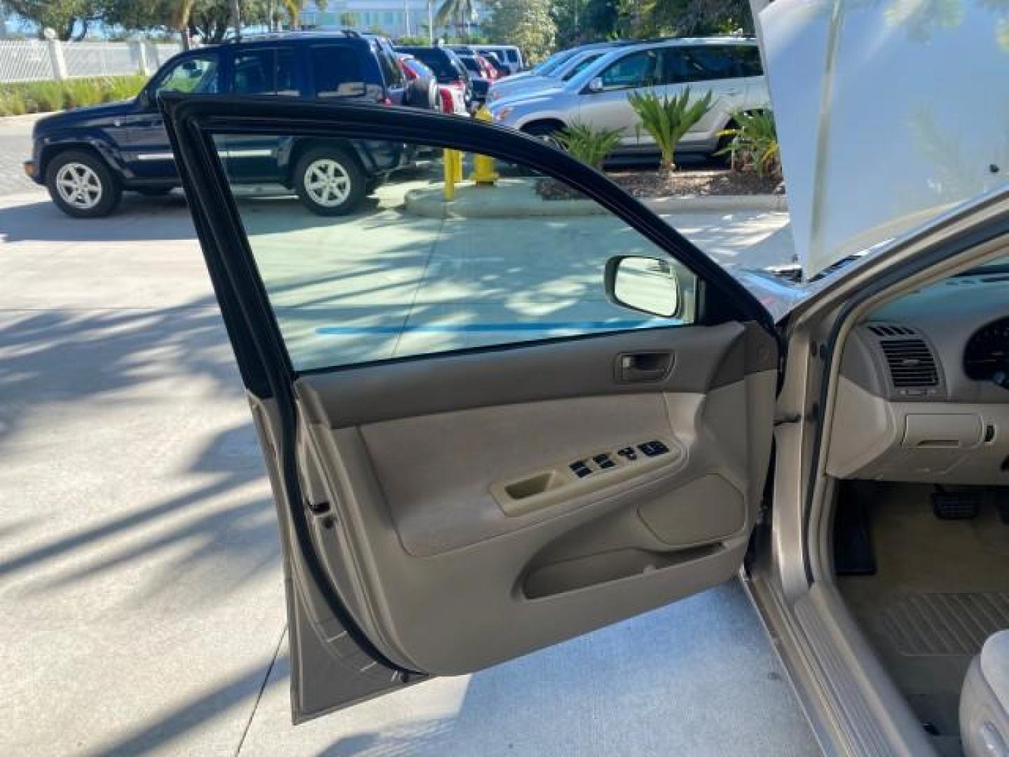 2004 Desert Sand Mica /Taupe Toyota Camry LE LOW MILES 25,414 ACTUAL (4T1BE32K04U) with an 2.4L DOHC MPFI Vvti 16-Valve 4-Cyl Engine engine, Automatic transmission, located at 4701 North Dixie Hwy, Pompano Beach, FL, 33064, (954) 422-2889, 26.240938, -80.123474 - OUR WEBPAGE FLORIDACARS1.COM HAS OVER 100 PHOTOS AND FREE CARFAX LINK 2004 TOYOTA CAMRY LE VIN: 4T1BE32K04U806344 4 T 1 B E 3 2 K 0 4 U 8 0 6 3 4 4 SEDAN 4 DR 2.4L I4 F DOHC 16V GASOLINE 32 MPG FRONT WHEEL DRIVE Features ABS Brakes Air Conditioning AM/FM Stereo Automatic Transmission Cassette Player - Photo#9