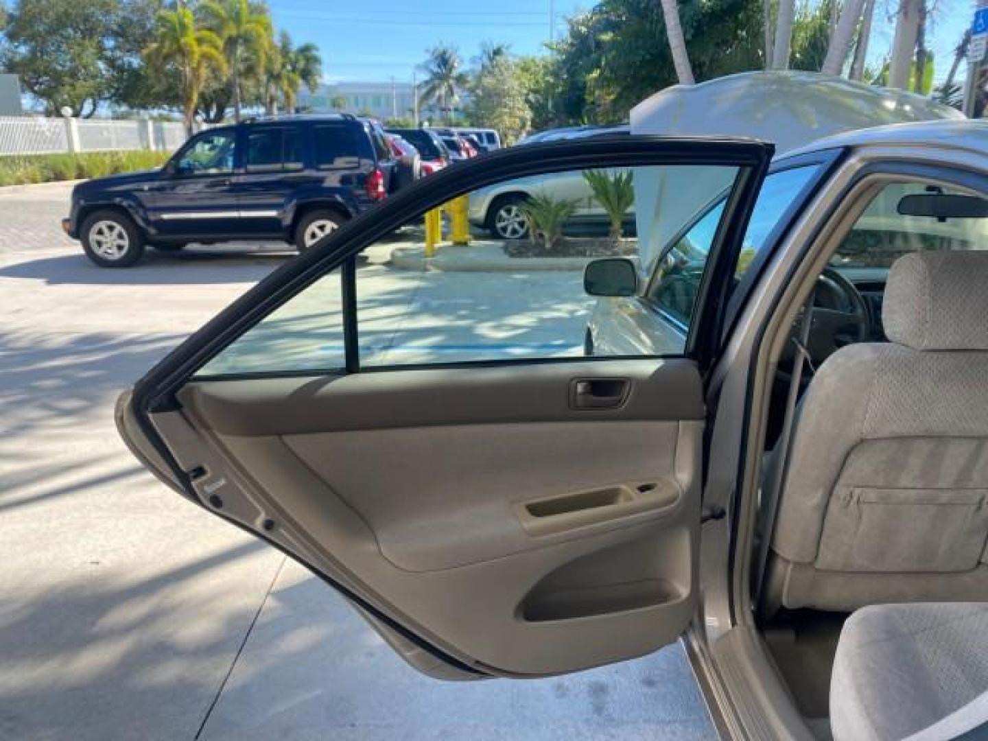 2004 Desert Sand Mica /Taupe Toyota Camry LE LOW MILES 25,414 ACTUAL (4T1BE32K04U) with an 2.4L DOHC MPFI Vvti 16-Valve 4-Cyl Engine engine, Automatic transmission, located at 4701 North Dixie Hwy, Pompano Beach, FL, 33064, (954) 422-2889, 26.240938, -80.123474 - OUR WEBPAGE FLORIDACARS1.COM HAS OVER 100 PHOTOS AND FREE CARFAX LINK 2004 TOYOTA CAMRY LE VIN: 4T1BE32K04U806344 4 T 1 B E 3 2 K 0 4 U 8 0 6 3 4 4 SEDAN 4 DR 2.4L I4 F DOHC 16V GASOLINE 32 MPG FRONT WHEEL DRIVE Features ABS Brakes Air Conditioning AM/FM Stereo Automatic Transmission Cassette Player - Photo#13