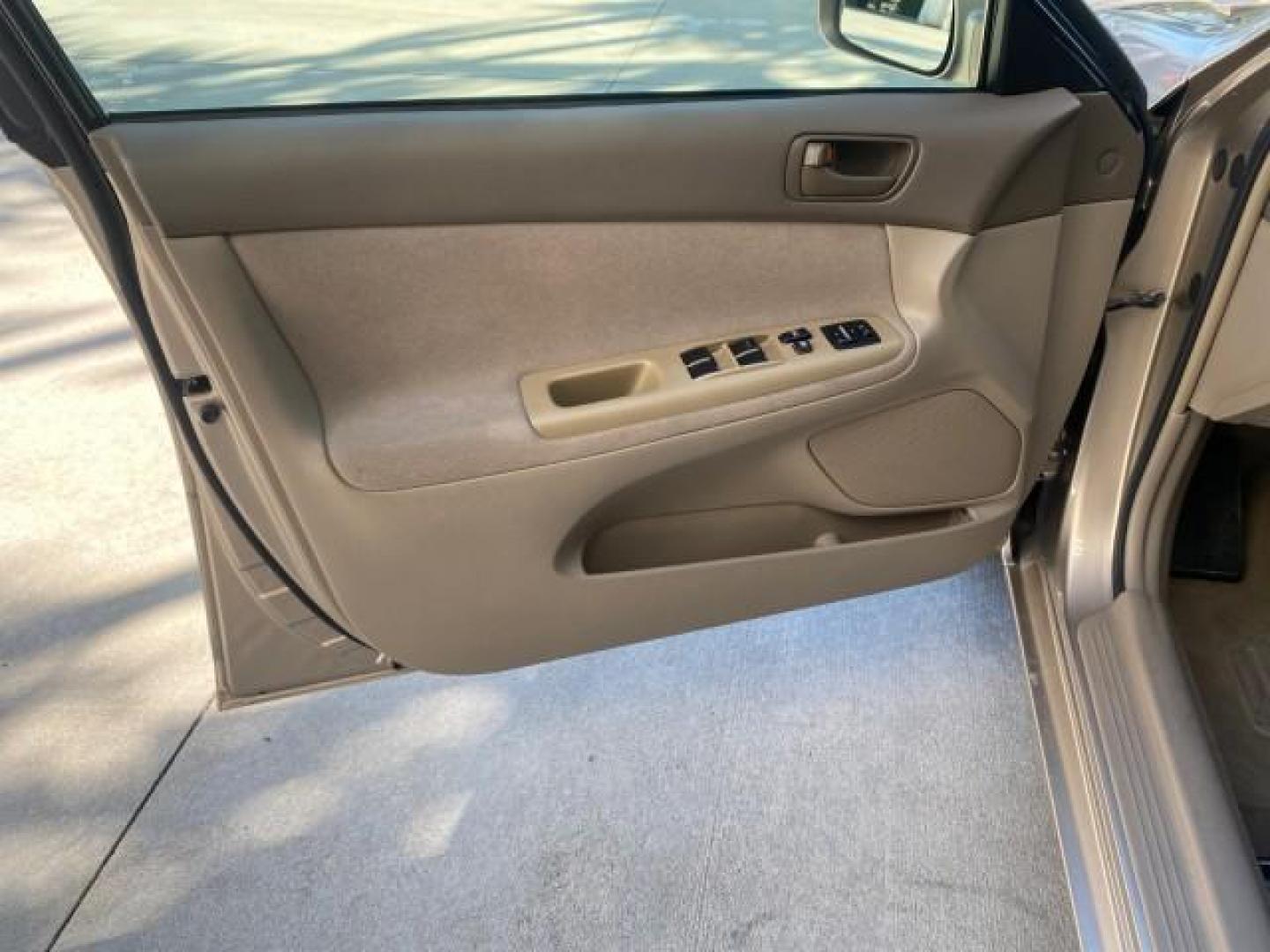 2004 Desert Sand Mica /Taupe Toyota Camry LE LOW MILES 25,414 ACTUAL (4T1BE32K04U) with an 2.4L DOHC MPFI Vvti 16-Valve 4-Cyl Engine engine, Automatic transmission, located at 4701 North Dixie Hwy, Pompano Beach, FL, 33064, (954) 422-2889, 26.240938, -80.123474 - OUR WEBPAGE FLORIDACARS1.COM HAS OVER 100 PHOTOS AND FREE CARFAX LINK 2004 TOYOTA CAMRY LE VIN: 4T1BE32K04U806344 4 T 1 B E 3 2 K 0 4 U 8 0 6 3 4 4 SEDAN 4 DR 2.4L I4 F DOHC 16V GASOLINE 32 MPG FRONT WHEEL DRIVE Features ABS Brakes Air Conditioning AM/FM Stereo Automatic Transmission Cassette Player - Photo#42