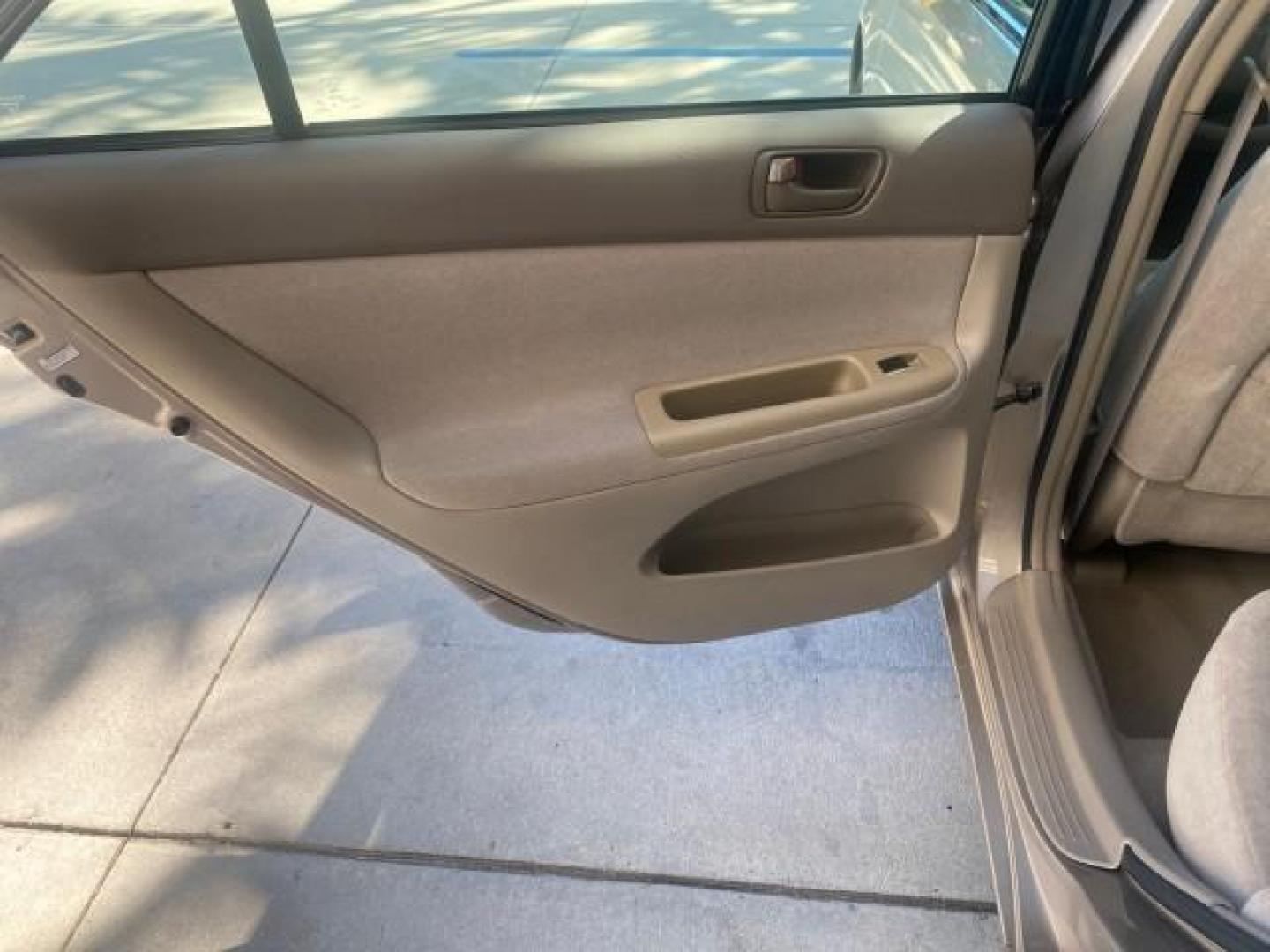 2004 Desert Sand Mica /Taupe Toyota Camry LE LOW MILES 25,414 ACTUAL (4T1BE32K04U) with an 2.4L DOHC MPFI Vvti 16-Valve 4-Cyl Engine engine, Automatic transmission, located at 4701 North Dixie Hwy, Pompano Beach, FL, 33064, (954) 422-2889, 26.240938, -80.123474 - OUR WEBPAGE FLORIDACARS1.COM HAS OVER 100 PHOTOS AND FREE CARFAX LINK 2004 TOYOTA CAMRY LE VIN: 4T1BE32K04U806344 4 T 1 B E 3 2 K 0 4 U 8 0 6 3 4 4 SEDAN 4 DR 2.4L I4 F DOHC 16V GASOLINE 32 MPG FRONT WHEEL DRIVE Features ABS Brakes Air Conditioning AM/FM Stereo Automatic Transmission Cassette Player - Photo#75