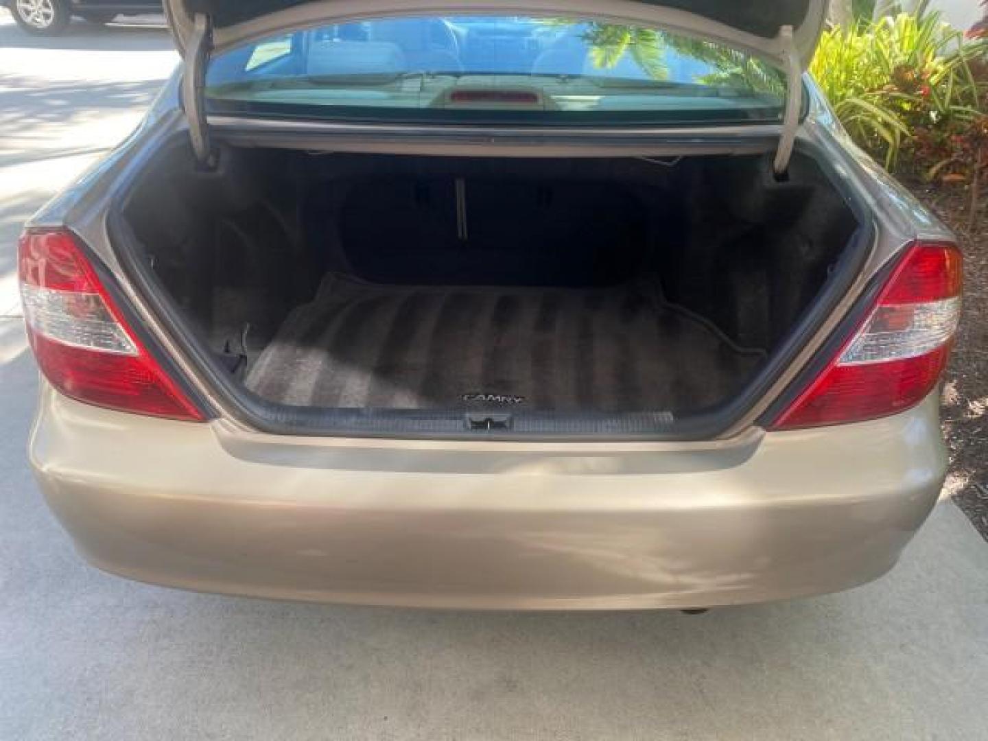 2004 Desert Sand Mica /Taupe Toyota Camry LE LOW MILES 25,414 ACTUAL (4T1BE32K04U) with an 2.4L DOHC MPFI Vvti 16-Valve 4-Cyl Engine engine, Automatic transmission, located at 4701 North Dixie Hwy, Pompano Beach, FL, 33064, (954) 422-2889, 26.240938, -80.123474 - OUR WEBPAGE FLORIDACARS1.COM HAS OVER 100 PHOTOS AND FREE CARFAX LINK 2004 TOYOTA CAMRY LE VIN: 4T1BE32K04U806344 4 T 1 B E 3 2 K 0 4 U 8 0 6 3 4 4 SEDAN 4 DR 2.4L I4 F DOHC 16V GASOLINE 32 MPG FRONT WHEEL DRIVE Features ABS Brakes Air Conditioning AM/FM Stereo Automatic Transmission Cassette Player - Photo#94