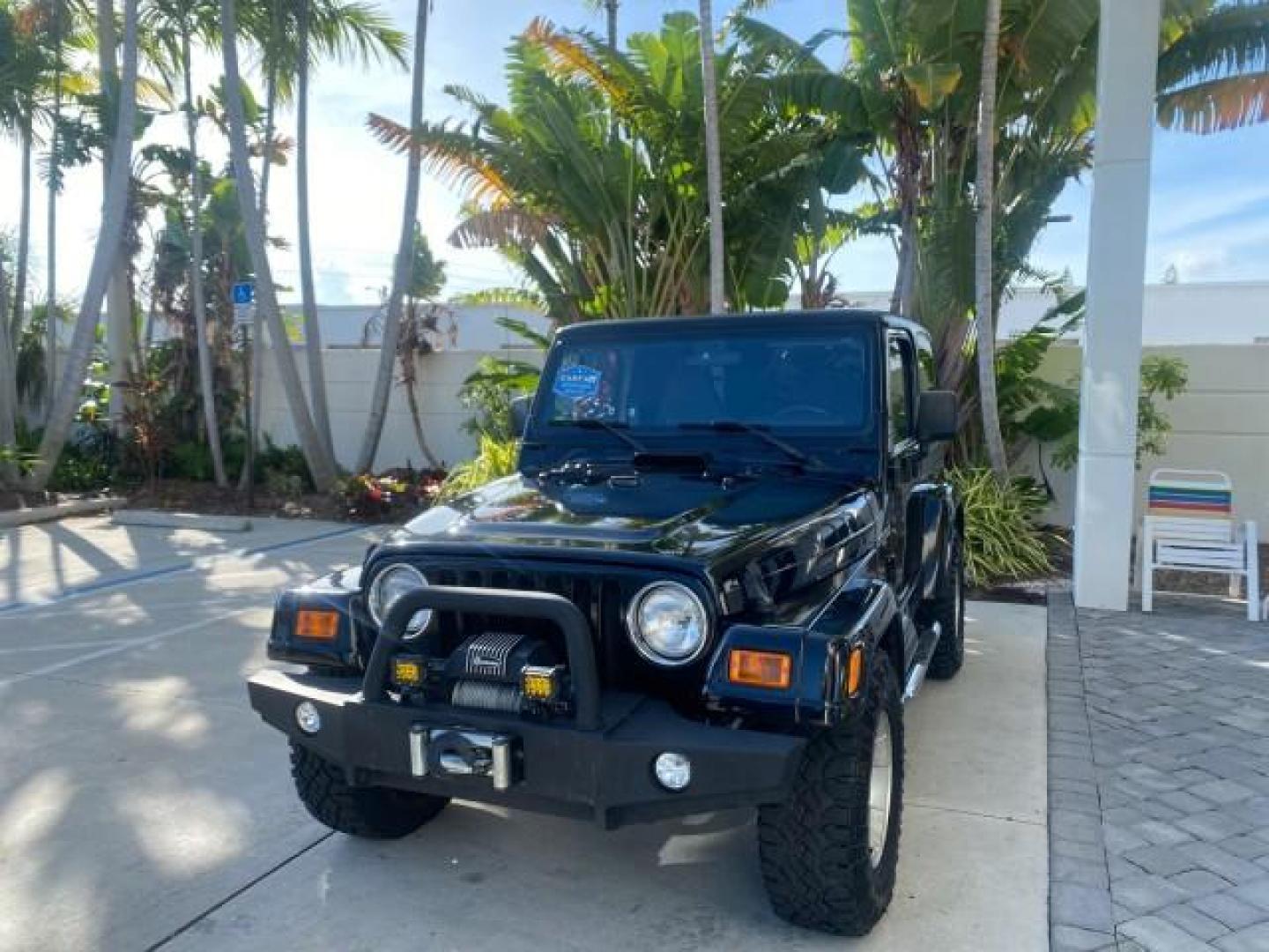 2001 Black /Agate Jeep Wrangler AUTO AC LOW MILES 77,760 HARD TOP (1J4FA49S61P) with an 4.0L SMFI I6 Power Tech Engine engine, Automatic transmission, located at 4701 North Dixie Hwy, Pompano Beach, FL, 33064, (954) 422-2889, 26.240938, -80.123474 - OUR WEBPAGE FLORIDACARS1.COM HAS OVER 100 PHOTOS AND FREE CARFAX LINK 2001 JEEP WRANGLER SPORT REMOVABLE HARD TOP VIN: 1J4FA49S61P364008 1 J 4 F A 4 9 S 6 1 P 3 6 4 0 0 8 UTILITY (BLAZER, JIMMY, SCOUT, ETC.) 4.0L I6 F GASOLINE REAR WHEEL DRIVE W/ 4X4 Features 4WD/AWD Air Conditioning Alloy Wheels AM - Photo#3