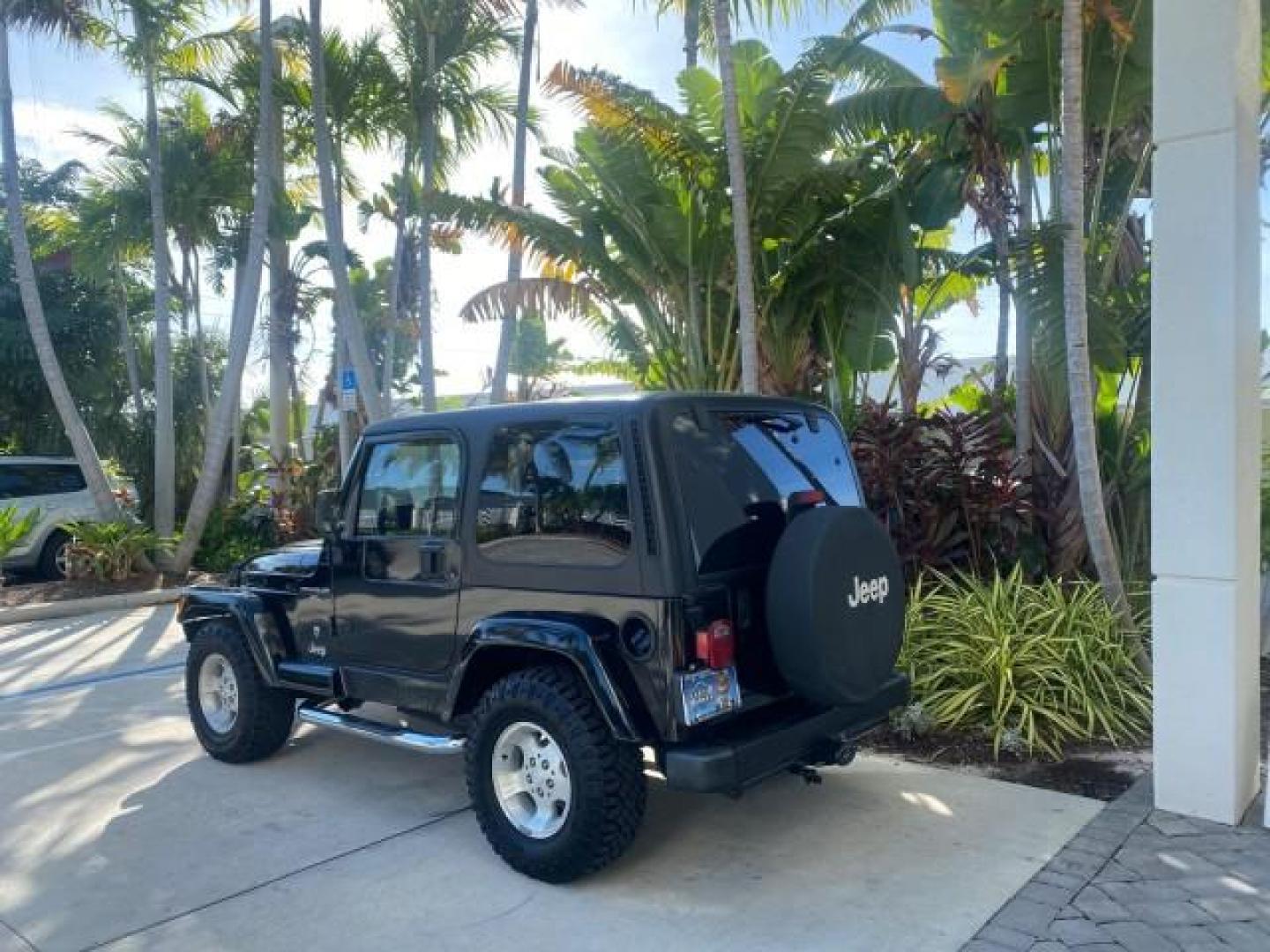 2001 Black /Agate Jeep Wrangler AUTO AC LOW MILES 77,760 HARD TOP (1J4FA49S61P) with an 4.0L SMFI I6 Power Tech Engine engine, Automatic transmission, located at 4701 North Dixie Hwy, Pompano Beach, FL, 33064, (954) 422-2889, 26.240938, -80.123474 - OUR WEBPAGE FLORIDACARS1.COM HAS OVER 100 PHOTOS AND FREE CARFAX LINK 2001 JEEP WRANGLER SPORT REMOVABLE HARD TOP VIN: 1J4FA49S61P364008 1 J 4 F A 4 9 S 6 1 P 3 6 4 0 0 8 UTILITY (BLAZER, JIMMY, SCOUT, ETC.) 4.0L I6 F GASOLINE REAR WHEEL DRIVE W/ 4X4 Features 4WD/AWD Air Conditioning Alloy Wheels AM - Photo#5