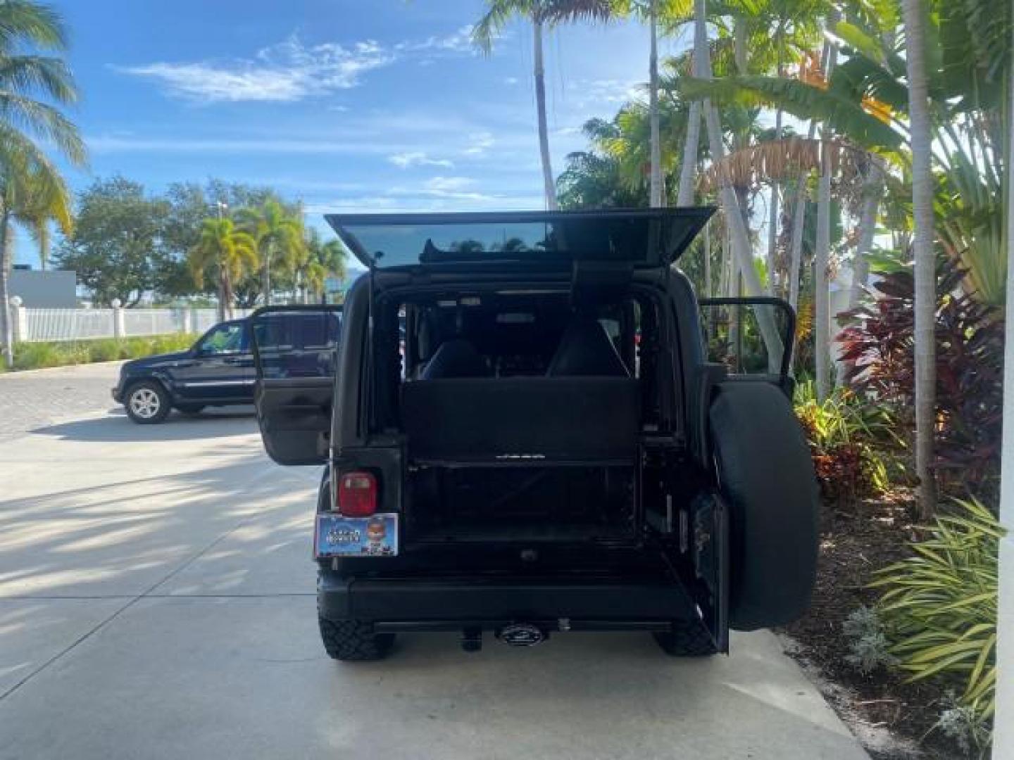 2001 Black /Agate Jeep Wrangler AUTO AC LOW MILES 77,760 HARD TOP (1J4FA49S61P) with an 4.0L SMFI I6 Power Tech Engine engine, Automatic transmission, located at 4701 North Dixie Hwy, Pompano Beach, FL, 33064, (954) 422-2889, 26.240938, -80.123474 - OUR WEBPAGE FLORIDACARS1.COM HAS OVER 100 PHOTOS AND FREE CARFAX LINK 2001 JEEP WRANGLER SPORT REMOVABLE HARD TOP VIN: 1J4FA49S61P364008 1 J 4 F A 4 9 S 6 1 P 3 6 4 0 0 8 UTILITY (BLAZER, JIMMY, SCOUT, ETC.) 4.0L I6 F GASOLINE REAR WHEEL DRIVE W/ 4X4 Features 4WD/AWD Air Conditioning Alloy Wheels AM - Photo#15
