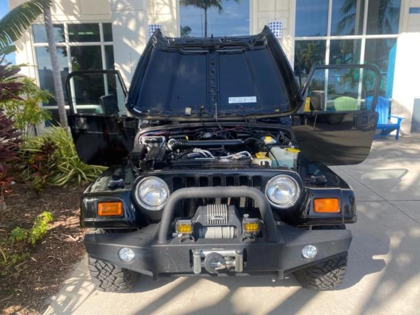 2001 Black /Agate Jeep Wrangler AUTO AC LOW MILES 77,760 HARD TOP (1J4FA49S61P) with an 4.0L SMFI I6 Power Tech Engine engine, Automatic transmission, located at 4701 North Dixie Hwy, Pompano Beach, FL, 33064, (954) 422-2889, 26.240938, -80.123474 - OUR WEBPAGE FLORIDACARS1.COM HAS OVER 100 PHOTOS AND FREE CARFAX LINK 2001 JEEP WRANGLER SPORT REMOVABLE HARD TOP VIN: 1J4FA49S61P364008 1 J 4 F A 4 9 S 6 1 P 3 6 4 0 0 8 UTILITY (BLAZER, JIMMY, SCOUT, ETC.) 4.0L I6 F GASOLINE REAR WHEEL DRIVE W/ 4X4 Features 4WD/AWD Air Conditioning Alloy Wheels AM - Photo#17