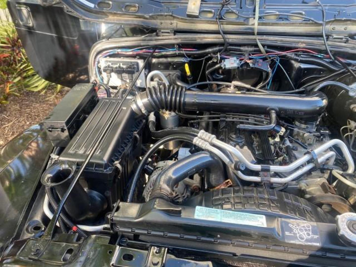 2001 Black /Agate Jeep Wrangler AUTO AC LOW MILES 77,760 HARD TOP (1J4FA49S61P) with an 4.0L SMFI I6 Power Tech Engine engine, Automatic transmission, located at 4701 North Dixie Hwy, Pompano Beach, FL, 33064, (954) 422-2889, 26.240938, -80.123474 - OUR WEBPAGE FLORIDACARS1.COM HAS OVER 100 PHOTOS AND FREE CARFAX LINK 2001 JEEP WRANGLER SPORT REMOVABLE HARD TOP VIN: 1J4FA49S61P364008 1 J 4 F A 4 9 S 6 1 P 3 6 4 0 0 8 UTILITY (BLAZER, JIMMY, SCOUT, ETC.) 4.0L I6 F GASOLINE REAR WHEEL DRIVE W/ 4X4 Features 4WD/AWD Air Conditioning Alloy Wheels AM - Photo#25