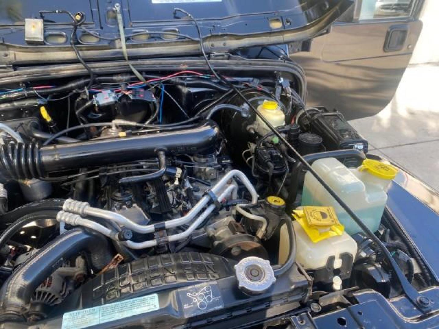 2001 Black /Agate Jeep Wrangler AUTO AC LOW MILES 77,760 HARD TOP (1J4FA49S61P) with an 4.0L SMFI I6 Power Tech Engine engine, Automatic transmission, located at 4701 North Dixie Hwy, Pompano Beach, FL, 33064, (954) 422-2889, 26.240938, -80.123474 - OUR WEBPAGE FLORIDACARS1.COM HAS OVER 100 PHOTOS AND FREE CARFAX LINK 2001 JEEP WRANGLER SPORT REMOVABLE HARD TOP VIN: 1J4FA49S61P364008 1 J 4 F A 4 9 S 6 1 P 3 6 4 0 0 8 UTILITY (BLAZER, JIMMY, SCOUT, ETC.) 4.0L I6 F GASOLINE REAR WHEEL DRIVE W/ 4X4 Features 4WD/AWD Air Conditioning Alloy Wheels AM - Photo#26