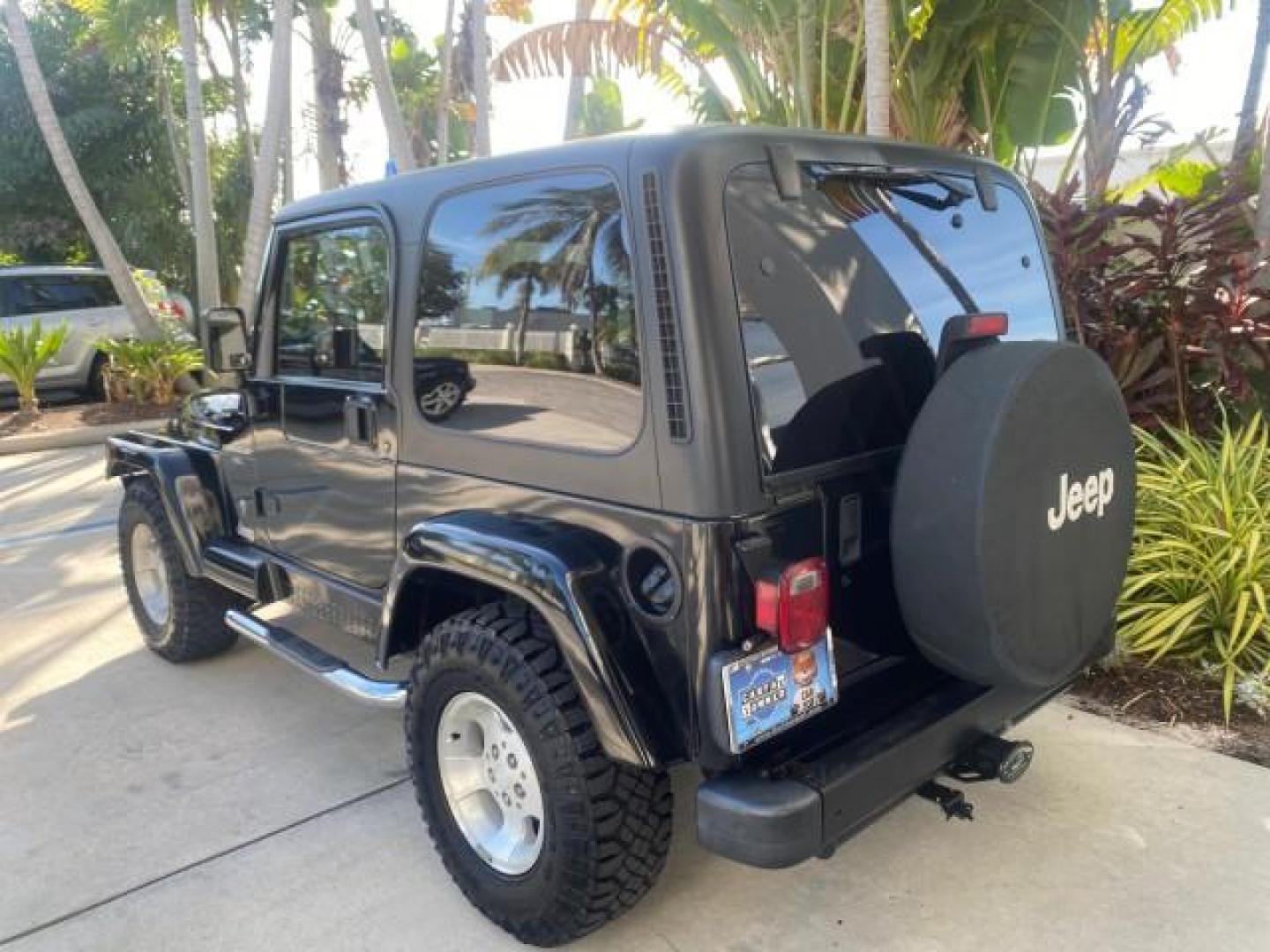 2001 Black /Agate Jeep Wrangler AUTO AC LOW MILES 77,760 HARD TOP (1J4FA49S61P) with an 4.0L SMFI I6 Power Tech Engine engine, Automatic transmission, located at 4701 North Dixie Hwy, Pompano Beach, FL, 33064, (954) 422-2889, 26.240938, -80.123474 - OUR WEBPAGE FLORIDACARS1.COM HAS OVER 100 PHOTOS AND FREE CARFAX LINK 2001 JEEP WRANGLER SPORT REMOVABLE HARD TOP VIN: 1J4FA49S61P364008 1 J 4 F A 4 9 S 6 1 P 3 6 4 0 0 8 UTILITY (BLAZER, JIMMY, SCOUT, ETC.) 4.0L I6 F GASOLINE REAR WHEEL DRIVE W/ 4X4 Features 4WD/AWD Air Conditioning Alloy Wheels AM - Photo#35