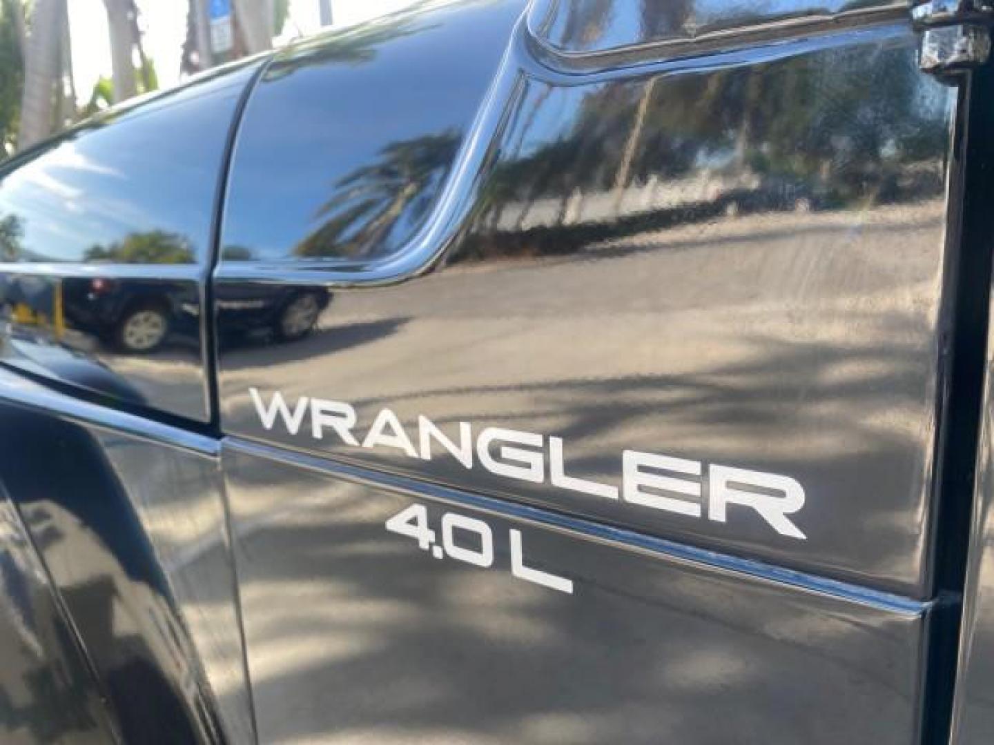 2001 Black /Agate Jeep Wrangler AUTO AC LOW MILES 77,760 HARD TOP (1J4FA49S61P) with an 4.0L SMFI I6 Power Tech Engine engine, Automatic transmission, located at 4701 North Dixie Hwy, Pompano Beach, FL, 33064, (954) 422-2889, 26.240938, -80.123474 - OUR WEBPAGE FLORIDACARS1.COM HAS OVER 100 PHOTOS AND FREE CARFAX LINK 2001 JEEP WRANGLER SPORT REMOVABLE HARD TOP VIN: 1J4FA49S61P364008 1 J 4 F A 4 9 S 6 1 P 3 6 4 0 0 8 UTILITY (BLAZER, JIMMY, SCOUT, ETC.) 4.0L I6 F GASOLINE REAR WHEEL DRIVE W/ 4X4 Features 4WD/AWD Air Conditioning Alloy Wheels AM - Photo#42