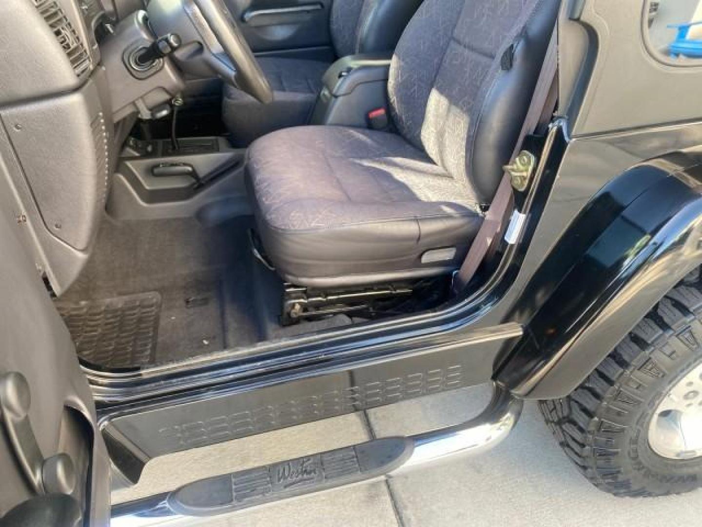 2001 Black /Agate Jeep Wrangler AUTO AC LOW MILES 77,760 HARD TOP (1J4FA49S61P) with an 4.0L SMFI I6 Power Tech Engine engine, Automatic transmission, located at 4701 North Dixie Hwy, Pompano Beach, FL, 33064, (954) 422-2889, 26.240938, -80.123474 - OUR WEBPAGE FLORIDACARS1.COM HAS OVER 100 PHOTOS AND FREE CARFAX LINK 2001 JEEP WRANGLER SPORT REMOVABLE HARD TOP VIN: 1J4FA49S61P364008 1 J 4 F A 4 9 S 6 1 P 3 6 4 0 0 8 UTILITY (BLAZER, JIMMY, SCOUT, ETC.) 4.0L I6 F GASOLINE REAR WHEEL DRIVE W/ 4X4 Features 4WD/AWD Air Conditioning Alloy Wheels AM - Photo#46