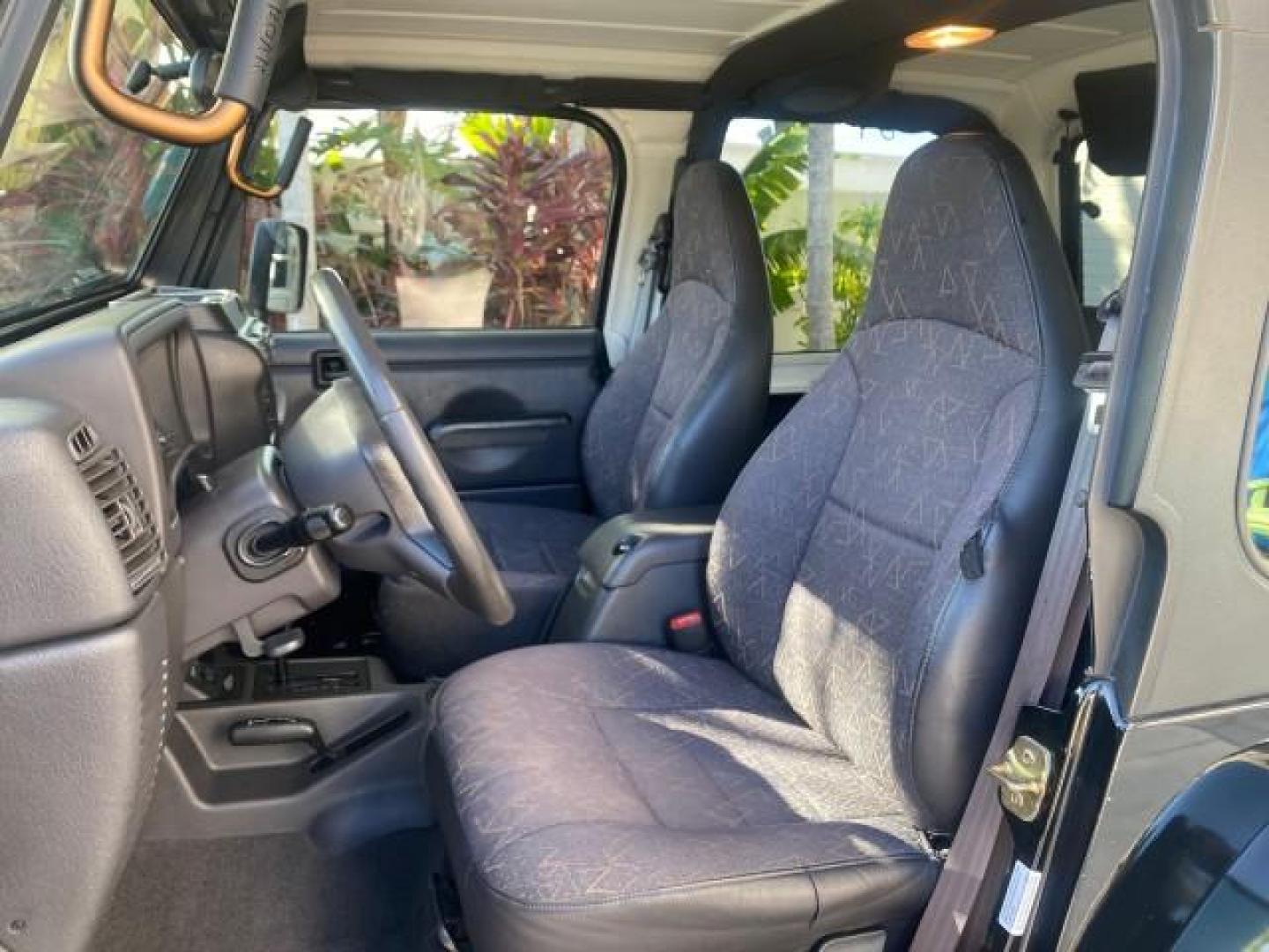 2001 Black /Agate Jeep Wrangler AUTO AC LOW MILES 77,760 HARD TOP (1J4FA49S61P) with an 4.0L SMFI I6 Power Tech Engine engine, Automatic transmission, located at 4701 North Dixie Hwy, Pompano Beach, FL, 33064, (954) 422-2889, 26.240938, -80.123474 - OUR WEBPAGE FLORIDACARS1.COM HAS OVER 100 PHOTOS AND FREE CARFAX LINK 2001 JEEP WRANGLER SPORT REMOVABLE HARD TOP VIN: 1J4FA49S61P364008 1 J 4 F A 4 9 S 6 1 P 3 6 4 0 0 8 UTILITY (BLAZER, JIMMY, SCOUT, ETC.) 4.0L I6 F GASOLINE REAR WHEEL DRIVE W/ 4X4 Features 4WD/AWD Air Conditioning Alloy Wheels AM - Photo#47