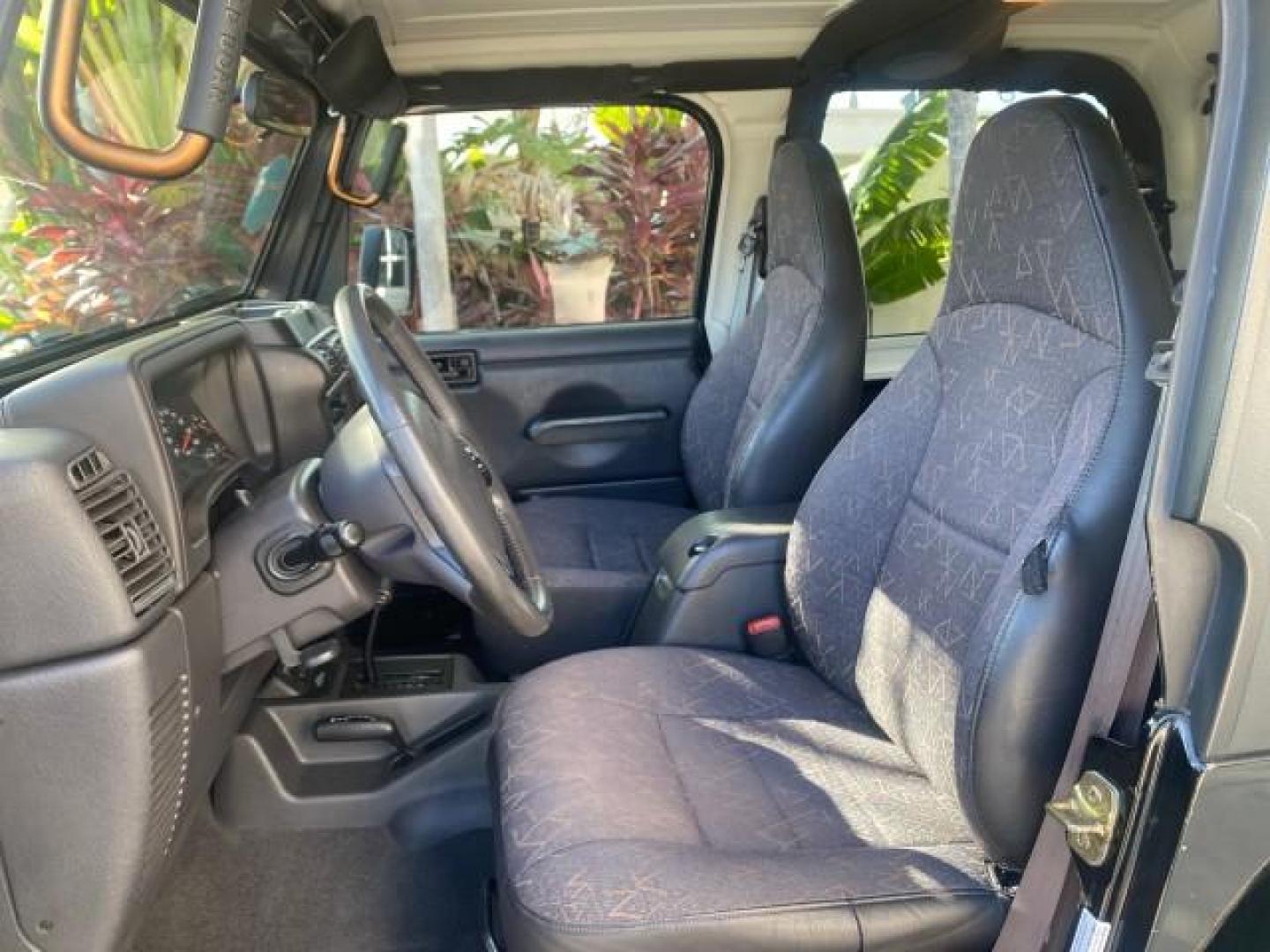 2001 Black /Agate Jeep Wrangler AUTO AC LOW MILES 77,760 HARD TOP (1J4FA49S61P) with an 4.0L SMFI I6 Power Tech Engine engine, Automatic transmission, located at 4701 North Dixie Hwy, Pompano Beach, FL, 33064, (954) 422-2889, 26.240938, -80.123474 - OUR WEBPAGE FLORIDACARS1.COM HAS OVER 100 PHOTOS AND FREE CARFAX LINK 2001 JEEP WRANGLER SPORT REMOVABLE HARD TOP VIN: 1J4FA49S61P364008 1 J 4 F A 4 9 S 6 1 P 3 6 4 0 0 8 UTILITY (BLAZER, JIMMY, SCOUT, ETC.) 4.0L I6 F GASOLINE REAR WHEEL DRIVE W/ 4X4 Features 4WD/AWD Air Conditioning Alloy Wheels AM - Photo#48