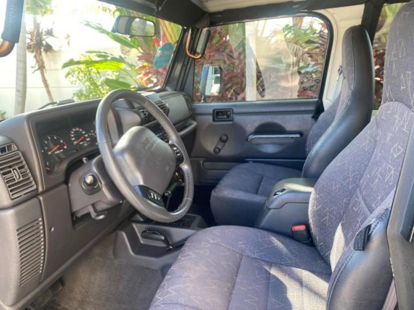 2001 Black /Agate Jeep Wrangler AUTO AC LOW MILES 77,760 HARD TOP (1J4FA49S61P) with an 4.0L SMFI I6 Power Tech Engine engine, Automatic transmission, located at 4701 North Dixie Hwy, Pompano Beach, FL, 33064, (954) 422-2889, 26.240938, -80.123474 - OUR WEBPAGE FLORIDACARS1.COM HAS OVER 100 PHOTOS AND FREE CARFAX LINK 2001 JEEP WRANGLER SPORT REMOVABLE HARD TOP VIN: 1J4FA49S61P364008 1 J 4 F A 4 9 S 6 1 P 3 6 4 0 0 8 UTILITY (BLAZER, JIMMY, SCOUT, ETC.) 4.0L I6 F GASOLINE REAR WHEEL DRIVE W/ 4X4 Features 4WD/AWD Air Conditioning Alloy Wheels AM - Photo#49