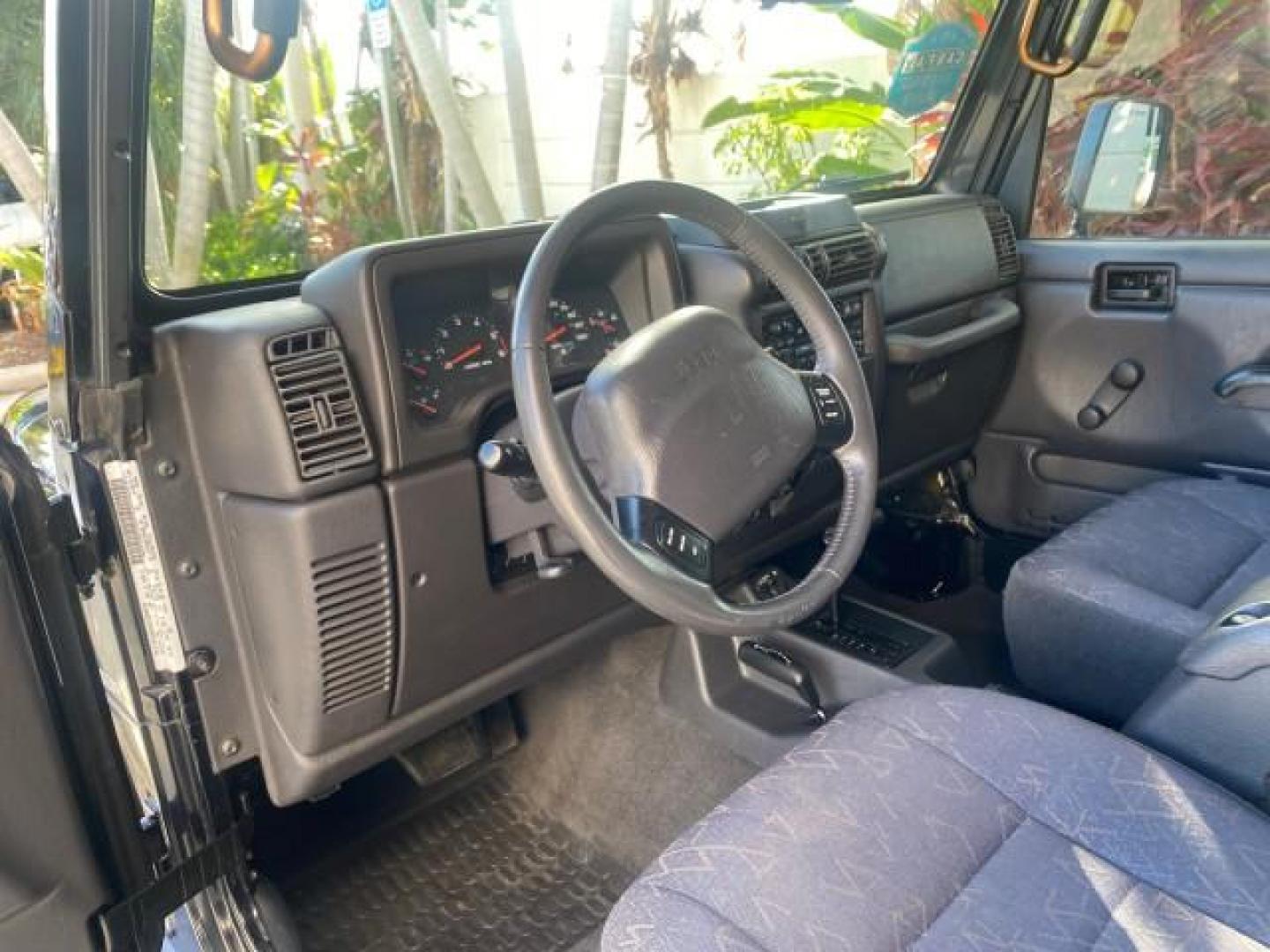 2001 Black /Agate Jeep Wrangler AUTO AC LOW MILES 77,760 HARD TOP (1J4FA49S61P) with an 4.0L SMFI I6 Power Tech Engine engine, Automatic transmission, located at 4701 North Dixie Hwy, Pompano Beach, FL, 33064, (954) 422-2889, 26.240938, -80.123474 - OUR WEBPAGE FLORIDACARS1.COM HAS OVER 100 PHOTOS AND FREE CARFAX LINK 2001 JEEP WRANGLER SPORT REMOVABLE HARD TOP VIN: 1J4FA49S61P364008 1 J 4 F A 4 9 S 6 1 P 3 6 4 0 0 8 UTILITY (BLAZER, JIMMY, SCOUT, ETC.) 4.0L I6 F GASOLINE REAR WHEEL DRIVE W/ 4X4 Features 4WD/AWD Air Conditioning Alloy Wheels AM - Photo#52