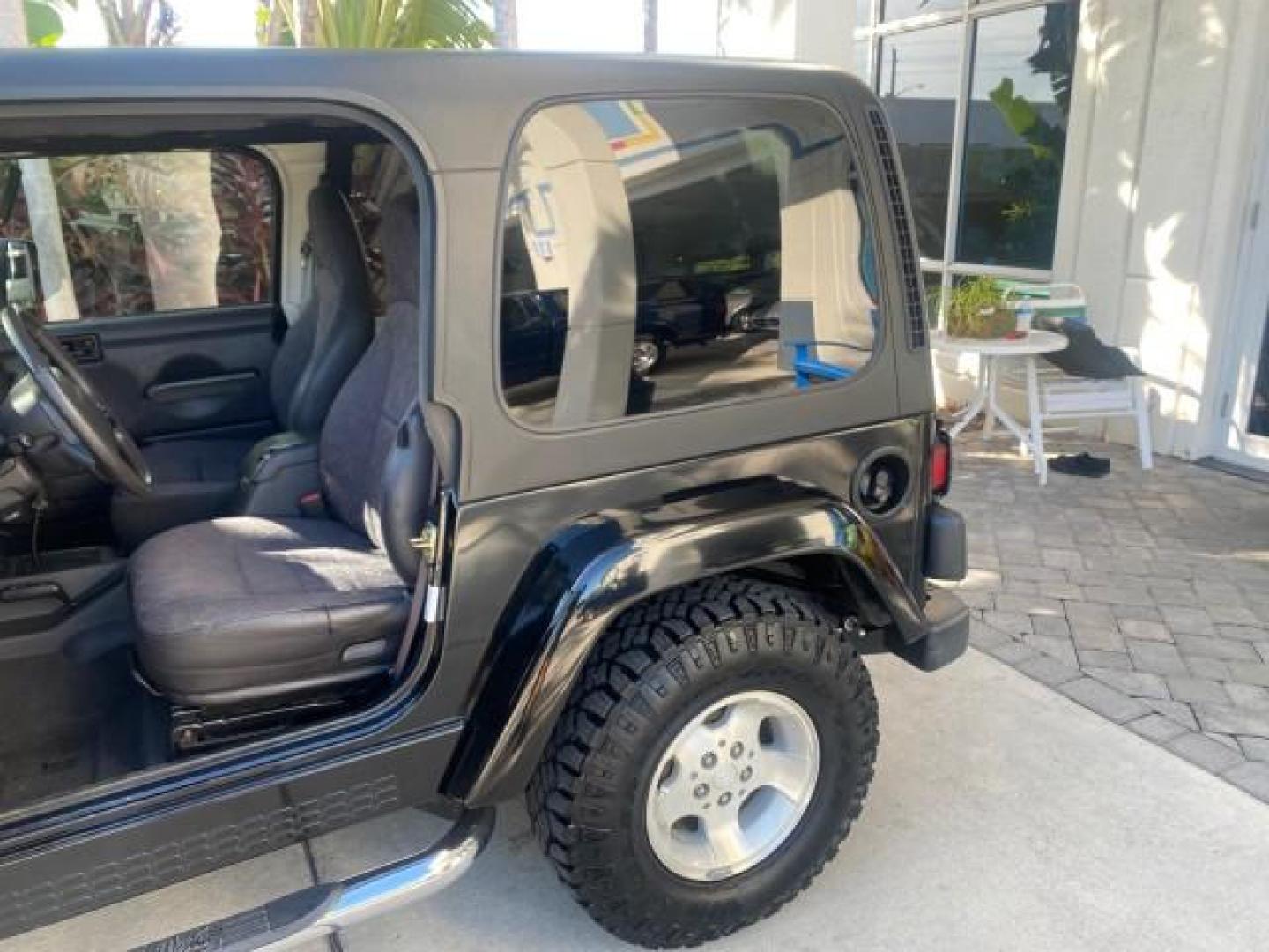 2001 Black /Agate Jeep Wrangler AUTO AC LOW MILES 77,760 HARD TOP (1J4FA49S61P) with an 4.0L SMFI I6 Power Tech Engine engine, Automatic transmission, located at 4701 North Dixie Hwy, Pompano Beach, FL, 33064, (954) 422-2889, 26.240938, -80.123474 - OUR WEBPAGE FLORIDACARS1.COM HAS OVER 100 PHOTOS AND FREE CARFAX LINK 2001 JEEP WRANGLER SPORT REMOVABLE HARD TOP VIN: 1J4FA49S61P364008 1 J 4 F A 4 9 S 6 1 P 3 6 4 0 0 8 UTILITY (BLAZER, JIMMY, SCOUT, ETC.) 4.0L I6 F GASOLINE REAR WHEEL DRIVE W/ 4X4 Features 4WD/AWD Air Conditioning Alloy Wheels AM - Photo#77
