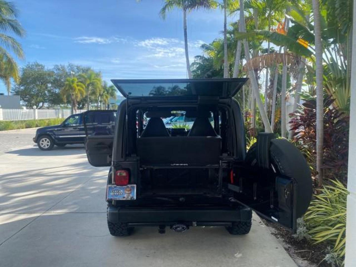 2001 Black /Agate Jeep Wrangler AUTO AC LOW MILES 77,760 HARD TOP (1J4FA49S61P) with an 4.0L SMFI I6 Power Tech Engine engine, Automatic transmission, located at 4701 North Dixie Hwy, Pompano Beach, FL, 33064, (954) 422-2889, 26.240938, -80.123474 - OUR WEBPAGE FLORIDACARS1.COM HAS OVER 100 PHOTOS AND FREE CARFAX LINK 2001 JEEP WRANGLER SPORT REMOVABLE HARD TOP VIN: 1J4FA49S61P364008 1 J 4 F A 4 9 S 6 1 P 3 6 4 0 0 8 UTILITY (BLAZER, JIMMY, SCOUT, ETC.) 4.0L I6 F GASOLINE REAR WHEEL DRIVE W/ 4X4 Features 4WD/AWD Air Conditioning Alloy Wheels AM - Photo#90