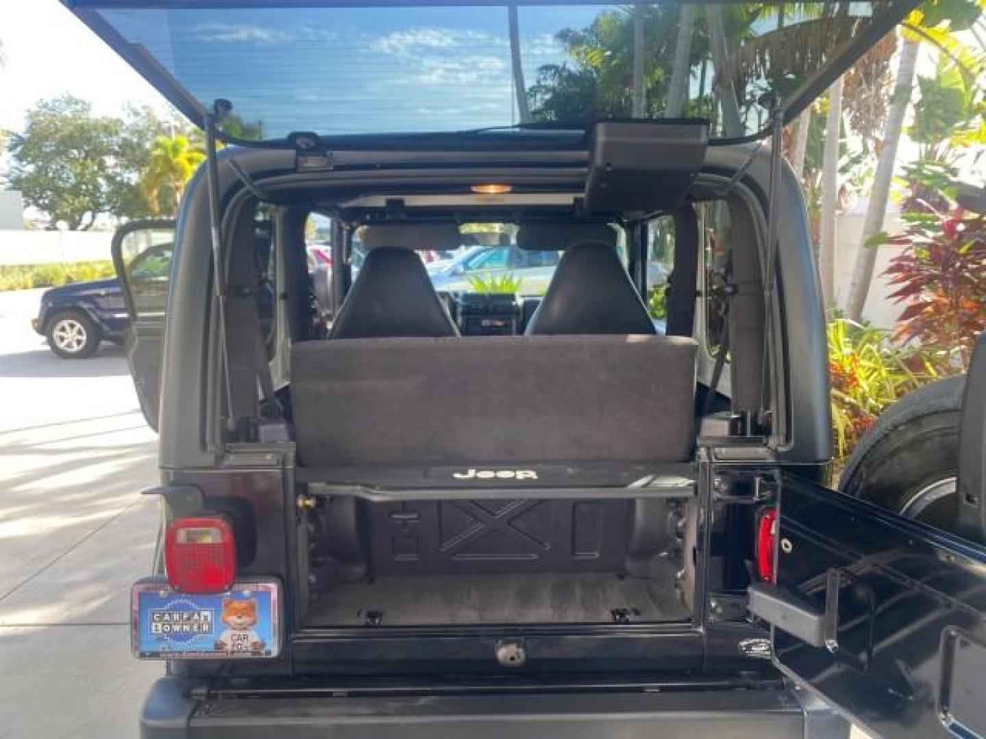 2001 Black /Agate Jeep Wrangler AUTO AC LOW MILES 77,760 HARD TOP (1J4FA49S61P) with an 4.0L SMFI I6 Power Tech Engine engine, Automatic transmission, located at 4701 North Dixie Hwy, Pompano Beach, FL, 33064, (954) 422-2889, 26.240938, -80.123474 - OUR WEBPAGE FLORIDACARS1.COM HAS OVER 100 PHOTOS AND FREE CARFAX LINK 2001 JEEP WRANGLER SPORT REMOVABLE HARD TOP VIN: 1J4FA49S61P364008 1 J 4 F A 4 9 S 6 1 P 3 6 4 0 0 8 UTILITY (BLAZER, JIMMY, SCOUT, ETC.) 4.0L I6 F GASOLINE REAR WHEEL DRIVE W/ 4X4 Features 4WD/AWD Air Conditioning Alloy Wheels AM - Photo#91