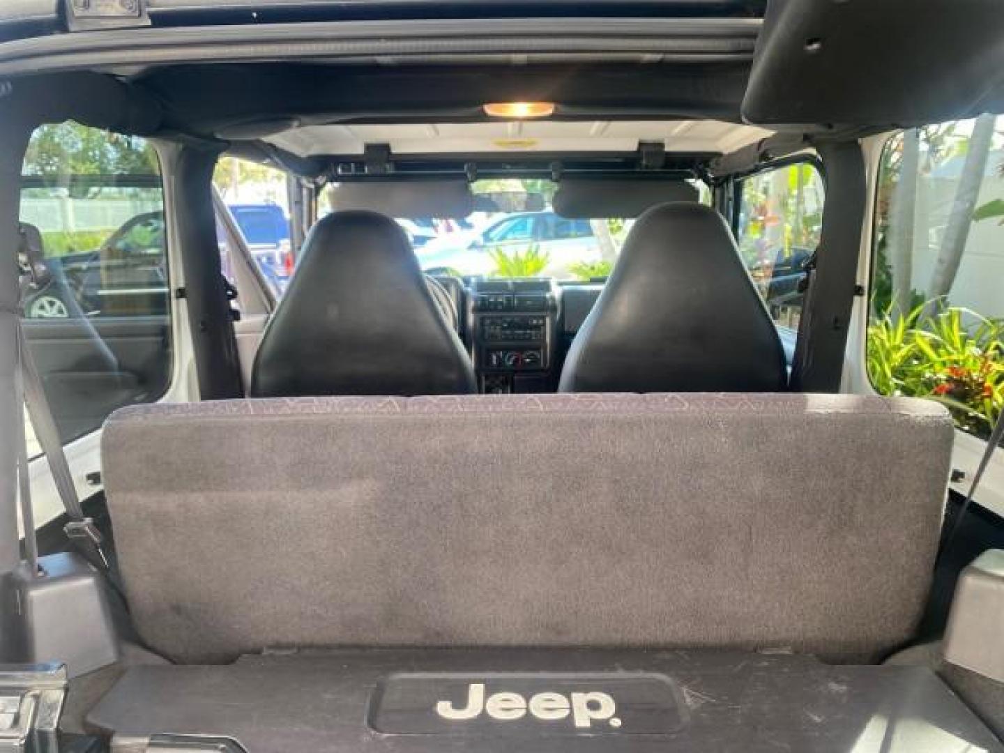 2001 Black /Agate Jeep Wrangler AUTO AC LOW MILES 77,760 HARD TOP (1J4FA49S61P) with an 4.0L SMFI I6 Power Tech Engine engine, Automatic transmission, located at 4701 North Dixie Hwy, Pompano Beach, FL, 33064, (954) 422-2889, 26.240938, -80.123474 - OUR WEBPAGE FLORIDACARS1.COM HAS OVER 100 PHOTOS AND FREE CARFAX LINK 2001 JEEP WRANGLER SPORT REMOVABLE HARD TOP VIN: 1J4FA49S61P364008 1 J 4 F A 4 9 S 6 1 P 3 6 4 0 0 8 UTILITY (BLAZER, JIMMY, SCOUT, ETC.) 4.0L I6 F GASOLINE REAR WHEEL DRIVE W/ 4X4 Features 4WD/AWD Air Conditioning Alloy Wheels AM - Photo#92