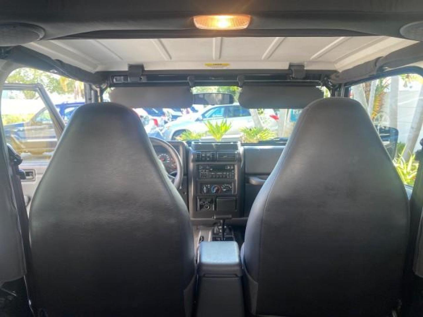 2001 Black /Agate Jeep Wrangler AUTO AC LOW MILES 77,760 HARD TOP (1J4FA49S61P) with an 4.0L SMFI I6 Power Tech Engine engine, Automatic transmission, located at 4701 North Dixie Hwy, Pompano Beach, FL, 33064, (954) 422-2889, 26.240938, -80.123474 - OUR WEBPAGE FLORIDACARS1.COM HAS OVER 100 PHOTOS AND FREE CARFAX LINK 2001 JEEP WRANGLER SPORT REMOVABLE HARD TOP VIN: 1J4FA49S61P364008 1 J 4 F A 4 9 S 6 1 P 3 6 4 0 0 8 UTILITY (BLAZER, JIMMY, SCOUT, ETC.) 4.0L I6 F GASOLINE REAR WHEEL DRIVE W/ 4X4 Features 4WD/AWD Air Conditioning Alloy Wheels AM - Photo#93