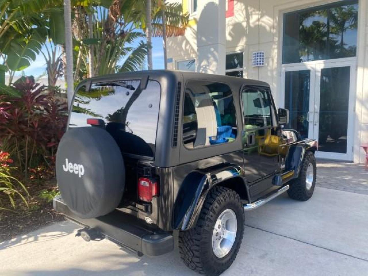 2001 Black /Agate Jeep Wrangler AUTO AC LOW MILES 77,760 HARD TOP (1J4FA49S61P) with an 4.0L SMFI I6 Power Tech Engine engine, Automatic transmission, located at 4701 North Dixie Hwy, Pompano Beach, FL, 33064, (954) 422-2889, 26.240938, -80.123474 - OUR WEBPAGE FLORIDACARS1.COM HAS OVER 100 PHOTOS AND FREE CARFAX LINK 2001 JEEP WRANGLER SPORT REMOVABLE HARD TOP VIN: 1J4FA49S61P364008 1 J 4 F A 4 9 S 6 1 P 3 6 4 0 0 8 UTILITY (BLAZER, JIMMY, SCOUT, ETC.) 4.0L I6 F GASOLINE REAR WHEEL DRIVE W/ 4X4 Features 4WD/AWD Air Conditioning Alloy Wheels AM - Photo#99