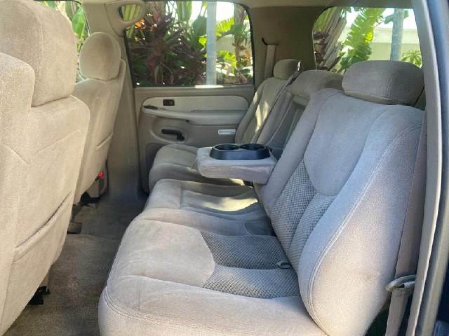 2003 Indigo Blue Metallic /Tan/Neutral Chevrolet Suburban LT 1 OWNER NO ACCIDENTS (1GNEC16Z13R) with an 5.3L Vortec 5300 V8 SFI Bi-Fuel Engine engine, Automatic transmission, located at 4701 North Dixie Hwy, Pompano Beach, FL, 33064, (954) 422-2889, 26.240938, -80.123474 - OUR WEBPAGE FLORIDACARS1.COM HAS OVER 100 PHOTOS AND FREE CARFAX LINK 2003 CHEVROLET SUBURBAN 1500 LS VIN: 1GNEC16Z13R307421 1 G N E C 1 6 Z 1 3 R 3 0 7 4 2 1 4 DOOR WAGON/SPORT UTILITY 5.3L V8 F FLEX FUEL 18 MPG REAR WHEEL DRIVE Features ABS Brakes Air Conditioning Alloy Wheels AM/FM Stereo Automat - Photo#73