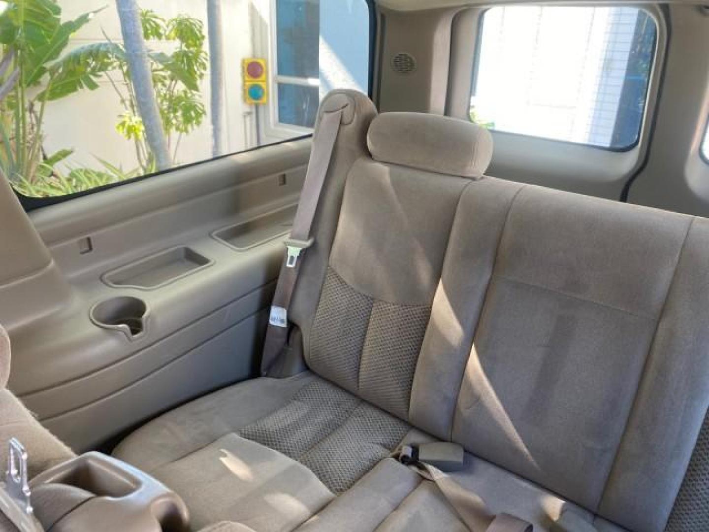 2003 Indigo Blue Metallic /Tan/Neutral Chevrolet Suburban LT 1 OWNER NO ACCIDENTS (1GNEC16Z13R) with an 5.3L Vortec 5300 V8 SFI Bi-Fuel Engine engine, Automatic transmission, located at 4701 North Dixie Hwy, Pompano Beach, FL, 33064, (954) 422-2889, 26.240938, -80.123474 - OUR WEBPAGE FLORIDACARS1.COM HAS OVER 100 PHOTOS AND FREE CARFAX LINK 2003 CHEVROLET SUBURBAN 1500 LS VIN: 1GNEC16Z13R307421 1 G N E C 1 6 Z 1 3 R 3 0 7 4 2 1 4 DOOR WAGON/SPORT UTILITY 5.3L V8 F FLEX FUEL 18 MPG REAR WHEEL DRIVE Features ABS Brakes Air Conditioning Alloy Wheels AM/FM Stereo Automat - Photo#80