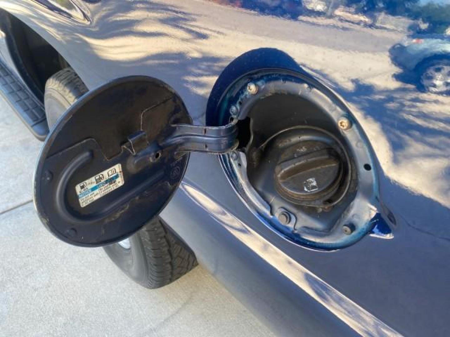 2003 Indigo Blue Metallic /Tan/Neutral Chevrolet Suburban LT 1 OWNER NO ACCIDENTS (1GNEC16Z13R) with an 5.3L Vortec 5300 V8 SFI Bi-Fuel Engine engine, Automatic transmission, located at 4701 North Dixie Hwy, Pompano Beach, FL, 33064, (954) 422-2889, 26.240938, -80.123474 - OUR WEBPAGE FLORIDACARS1.COM HAS OVER 100 PHOTOS AND FREE CARFAX LINK 2003 CHEVROLET SUBURBAN 1500 LS VIN: 1GNEC16Z13R307421 1 G N E C 1 6 Z 1 3 R 3 0 7 4 2 1 4 DOOR WAGON/SPORT UTILITY 5.3L V8 F FLEX FUEL 18 MPG REAR WHEEL DRIVE Features ABS Brakes Air Conditioning Alloy Wheels AM/FM Stereo Automat - Photo#88