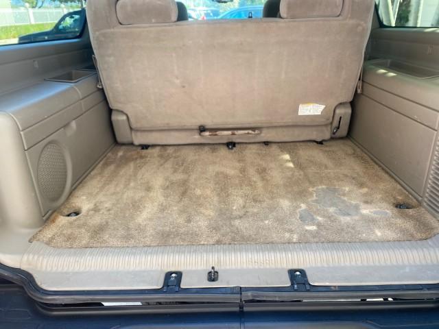 2003 Indigo Blue Metallic /Tan/Neutral Chevrolet Suburban LT 1 OWNER NO ACCIDENTS (1GNEC16Z13R) with an 5.3L Vortec 5300 V8 SFI Bi-Fuel Engine engine, Automatic transmission, located at 4701 North Dixie Hwy, Pompano Beach, FL, 33064, (954) 422-2889, 26.240938, -80.123474 - OUR WEBPAGE FLORIDACARS1.COM HAS OVER 100 PHOTOS AND FREE CARFAX LINK 2003 CHEVROLET SUBURBAN 1500 LS VIN: 1GNEC16Z13R307421 1 G N E C 1 6 Z 1 3 R 3 0 7 4 2 1 4 DOOR WAGON/SPORT UTILITY 5.3L V8 F FLEX FUEL 18 MPG REAR WHEEL DRIVE Features ABS Brakes Air Conditioning Alloy Wheels AM/FM Stereo Automat - Photo#95