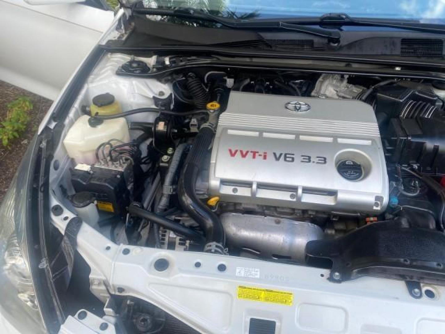 2007 Blizzard Pearl /Ivory Toyota Camry Solara SLE LOW MILES 67,647 (4T1FA38P37U) with an 3.3L DOHC SMPI VVT-i 24-Valve V6 Engine engine, Automatic transmission, located at 4701 North Dixie Hwy, Pompano Beach, FL, 33064, (954) 422-2889, 26.240938, -80.123474 - OUR WEBPAGE FLORIDACARS1.COM HAS OVER 100 PHOTOS AND FREE CARFAX LINK 2007 TOYOTA CAMRY SOLARA SLE V6 VIN: 4T1FA38P37U115572 4 T 1 F A 3 8 P 3 7 U 1 1 5 5 7 2 CONVERTIBLE 3.3L V6 F DOHC 24V GASOLINE 29 MPG FRONT WHEEL DRIVE Features ABS Brakes Air Conditioning Alloy Wheels AM/FM Stereo Automatic Tra - Photo#25