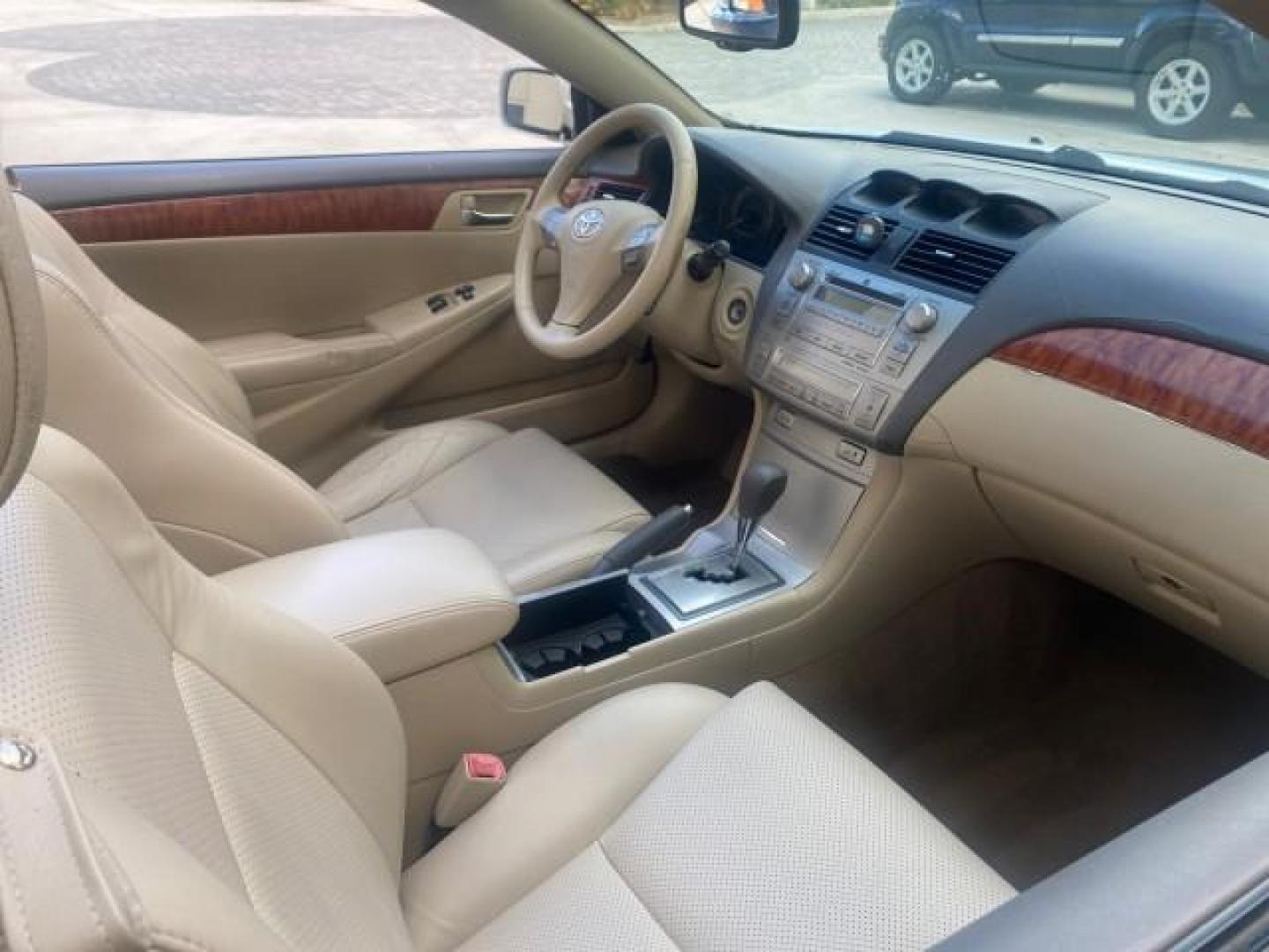 2007 Blizzard Pearl /Ivory Toyota Camry Solara SLE LOW MILES 67,647 (4T1FA38P37U) with an 3.3L DOHC SMPI VVT-i 24-Valve V6 Engine engine, Automatic transmission, located at 4701 North Dixie Hwy, Pompano Beach, FL, 33064, (954) 422-2889, 26.240938, -80.123474 - OUR WEBPAGE FLORIDACARS1.COM HAS OVER 100 PHOTOS AND FREE CARFAX LINK 2007 TOYOTA CAMRY SOLARA SLE V6 VIN: 4T1FA38P37U115572 4 T 1 F A 3 8 P 3 7 U 1 1 5 5 7 2 CONVERTIBLE 3.3L V6 F DOHC 24V GASOLINE 29 MPG FRONT WHEEL DRIVE Features ABS Brakes Air Conditioning Alloy Wheels AM/FM Stereo Automatic Tra - Photo#54