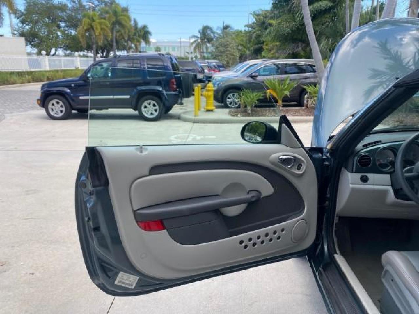 2006 Marine Blue Pearl /Pastel Slate Gray Chrysler PT Cruiser CONV Touring LOW MILES 36,241 (3C3JY55E06T) with an 2.4L DOHC SMPI 16-Valve I4 Engine engine, Automatic transmission, located at 4701 North Dixie Hwy, Pompano Beach, FL, 33064, (954) 422-2889, 26.240938, -80.123474 - OUR WEBPAGE FLORIDACARS1.COM HAS OVER 100 PHOTOS AND FREE CARFAX LINK 2006 CHRYSLER PT CRUISER TOURING TOP WORKS GREAT VIN: 3C3JY55E06T270148 3 C 3 J Y 5 5 E 0 6 T 2 7 0 1 4 8 CONVERTIBLE 2.4L I4 F DOHC 16V TURBO GASOLINE 26 MPG FRONT WHEEL DRIVE Features ABS Brakes Air Conditioning Alloy Wheels AM/ - Photo#9