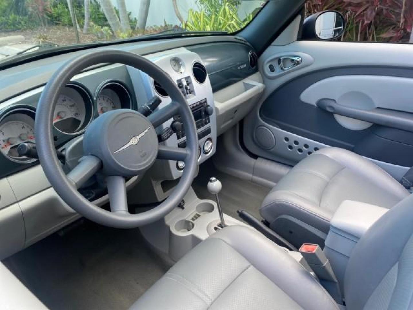 2006 Marine Blue Pearl /Pastel Slate Gray Chrysler PT Cruiser CONV Touring LOW MILES 36,241 (3C3JY55E06T) with an 2.4L DOHC SMPI 16-Valve I4 Engine engine, Automatic transmission, located at 4701 North Dixie Hwy, Pompano Beach, FL, 33064, (954) 422-2889, 26.240938, -80.123474 - OUR WEBPAGE FLORIDACARS1.COM HAS OVER 100 PHOTOS AND FREE CARFAX LINK 2006 CHRYSLER PT CRUISER TOURING TOP WORKS GREAT VIN: 3C3JY55E06T270148 3 C 3 J Y 5 5 E 0 6 T 2 7 0 1 4 8 CONVERTIBLE 2.4L I4 F DOHC 16V TURBO GASOLINE 26 MPG FRONT WHEEL DRIVE Features ABS Brakes Air Conditioning Alloy Wheels AM/ - Photo#49