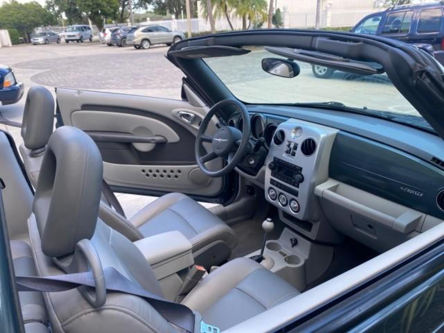 2006 Marine Blue Pearl /Pastel Slate Gray Chrysler PT Cruiser CONV Touring LOW MILES 36,241 (3C3JY55E06T) with an 2.4L DOHC SMPI 16-Valve I4 Engine engine, Automatic transmission, located at 4701 North Dixie Hwy, Pompano Beach, FL, 33064, (954) 422-2889, 26.240938, -80.123474 - OUR WEBPAGE FLORIDACARS1.COM HAS OVER 100 PHOTOS AND FREE CARFAX LINK 2006 CHRYSLER PT CRUISER TOURING TOP WORKS GREAT VIN: 3C3JY55E06T270148 3 C 3 J Y 5 5 E 0 6 T 2 7 0 1 4 8 CONVERTIBLE 2.4L I4 F DOHC 16V TURBO GASOLINE 26 MPG FRONT WHEEL DRIVE Features ABS Brakes Air Conditioning Alloy Wheels AM/ - Photo#50