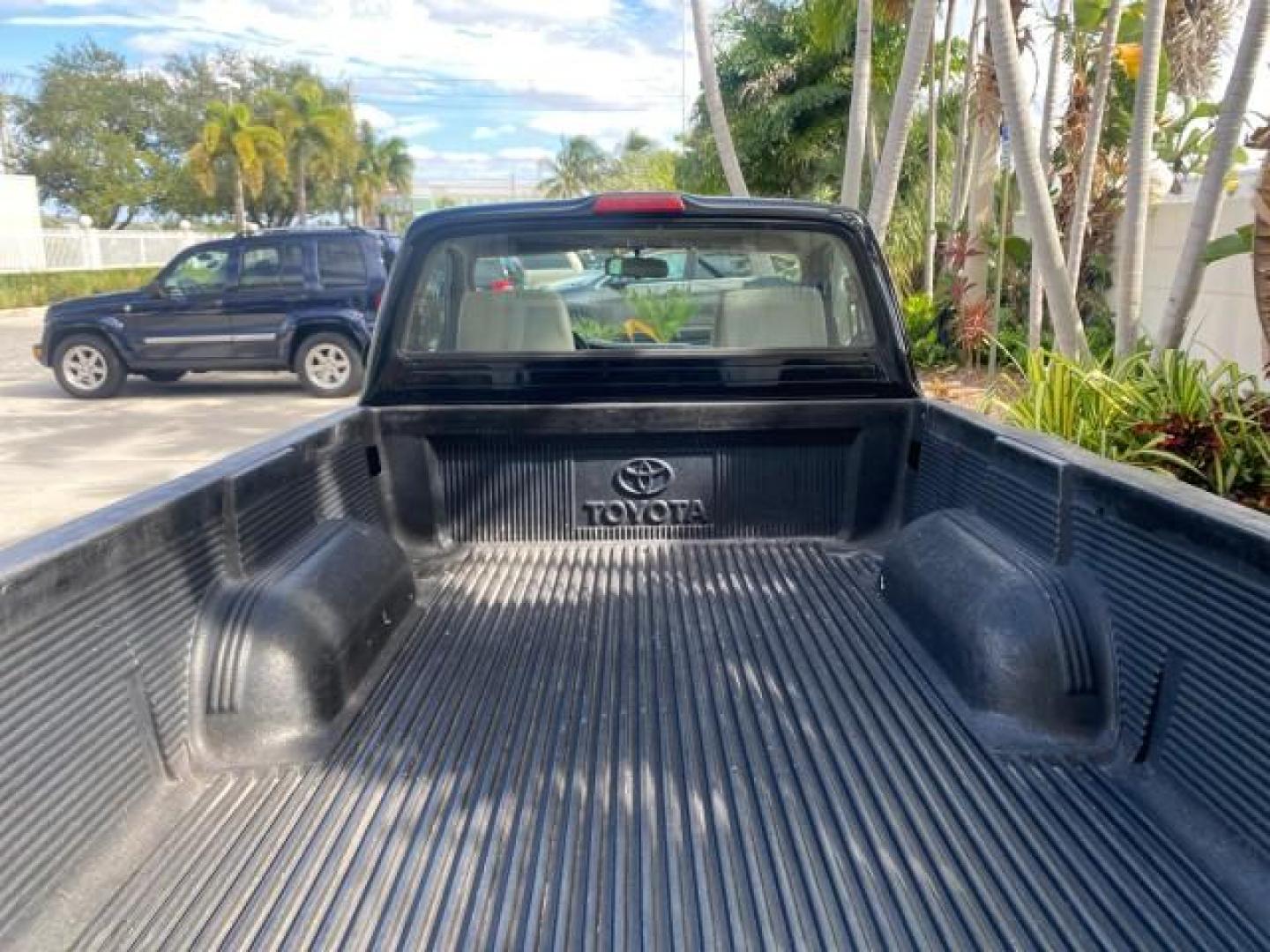 2002 Black Sand Pearl /Charcoal Toyota Tacoma 1 OWNER AUTO AC 4 CYL (5TENL42N02Z) with an 2.4L DOHC EFI 16-Valve I4 Engine engine, Automatic transmission, located at 4701 North Dixie Hwy, Pompano Beach, FL, 33064, (954) 422-2889, 26.240938, -80.123474 - OUR WEBPAGE FLORIDACARS1.COM HAS OVER 100 PHOTOS AND FREE CARFAX LINK 2002 TOYOTA TACOMA VIN: 5TENL42N02Z111289 5 T E N L 4 2 N 0 2 Z 1 1 1 2 8 9 PICKUP 2.4L I4 F DOHC GASOLINE 29 MPG REAR WHEEL DRIVE Features Air Conditioning AM/FM Stereo Automatic Transmission Bed Liner Cassette Player Cloth Seats - Photo#88